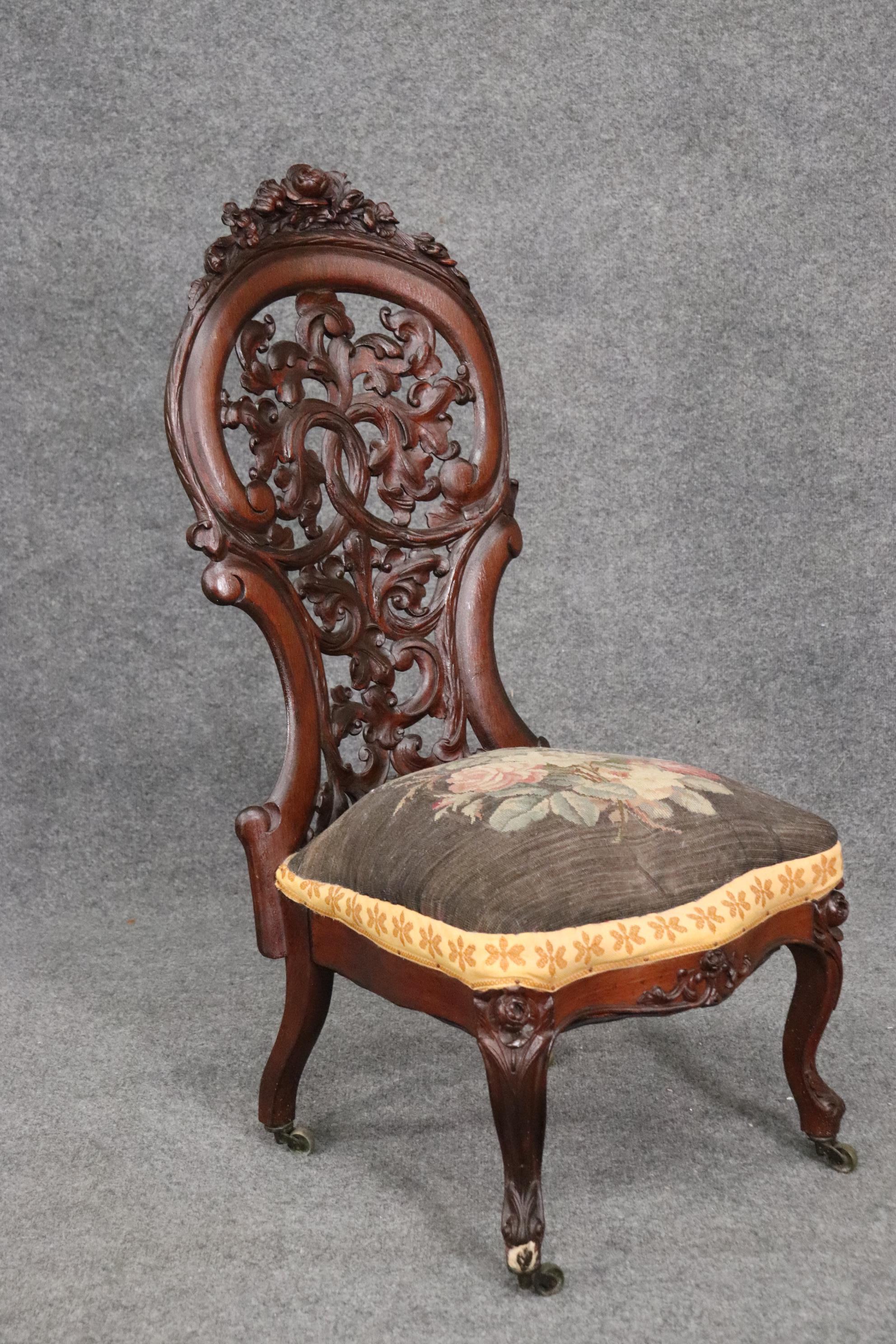 This is a gorgeous Meeks or Belter rosewood side chair. The chair is in good original condition and has no major issues. This chair measures 40 tall x 19 wide x 21 deep and the seat height is 16 inches.