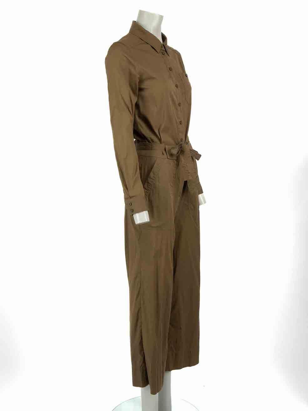 CONDITION is Very good. Minimal wear to jumpsuit is evident. Minimal discoloured marks to overall fabric on this used ME+EM designer resale item.
 
Details
Khaki
Cotton
Jumpsuit
Long sleeves
Straight leg
Button and zip fastening
Buttoned cuffs
Belt