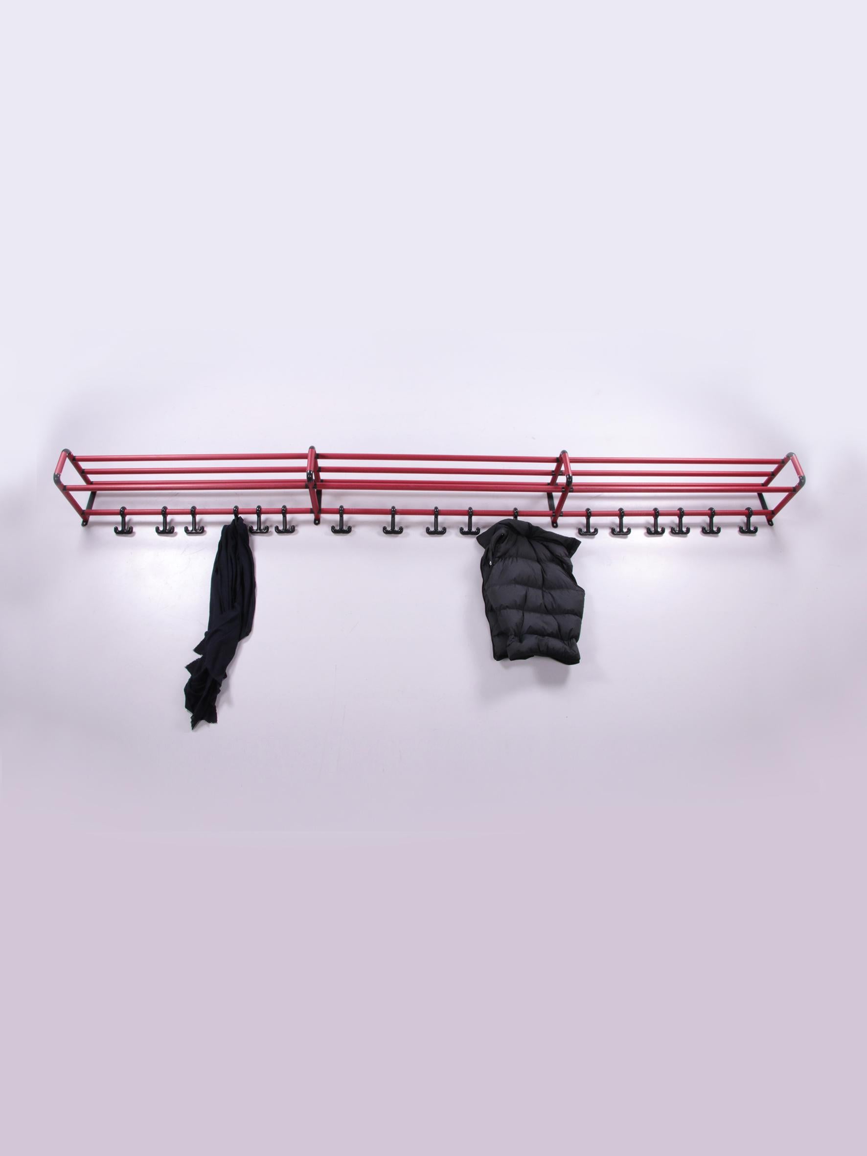 Mega long wall coat rack Spage Age the length is 3.50 meters, 1970s


This is a long coat rack. Length is 3.5 meters long.

They are deep red metal tubes with four brackets at the back to be able to hang it properly. This wall coat rack has