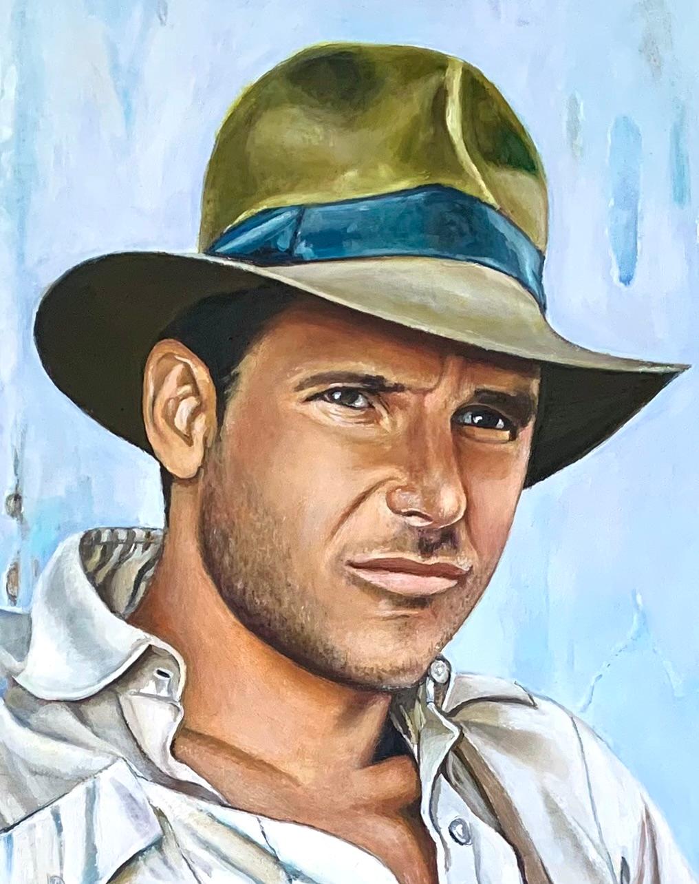“Portrait of a young Indiana Jones” Original Oil Painting measuring 16”x20” is framed in a hand finished gold leaf frame. Harrison Ford embodied the character of Indiana Jones and this relaxed cool toned rendition of him is from the first film