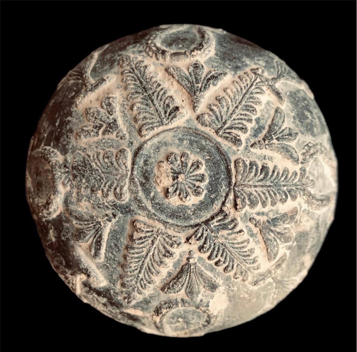 The body is adorned with pastillage reliefs depicting palms, garlands, amphorae, as well as other stylized motifs.

The Megarian Bowls are relief-decorated bowls which originate from the Hellenistic period, where they became much more popular than