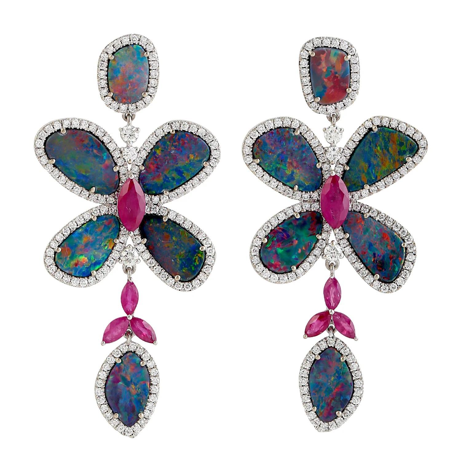 Handcrafted from 18-karat gold, these exquisite drop earrings are set with 10.02 carats Opal, 2.52 carat ruby and 2.32 carats of glimmering diamonds. 

FOLLOW  MEGHNA JEWELS storefront to view the latest collection & exclusive pieces.  Meghna Jewels