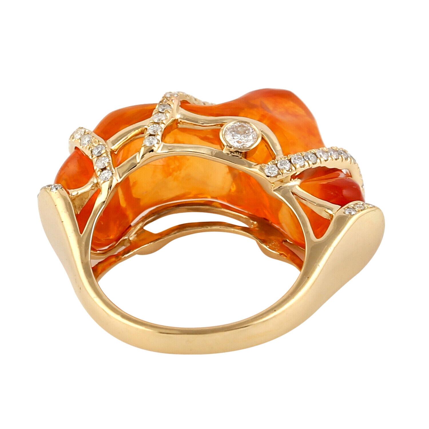 This ring has been meticulously crafted from 18-karat gold, 14.19 carat fire opal and handset with .55 carats of sparkling diamonds. This is a one-of-a-kind ring.  

The ring is a size 7 and may be resized to larger or smaller upon request. 
FOLLOW 