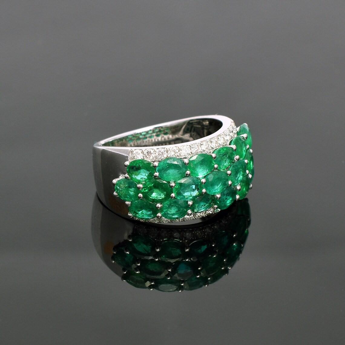 This ring has been meticulously crafted from 18-karat gold.  It is hand set with 3.93 carats emerald & .36 carats of sparkling diamonds. 

The ring is a size 7 and may be resized to larger or smaller upon request. 
FOLLOW  MEGHNA JEWELS storefront