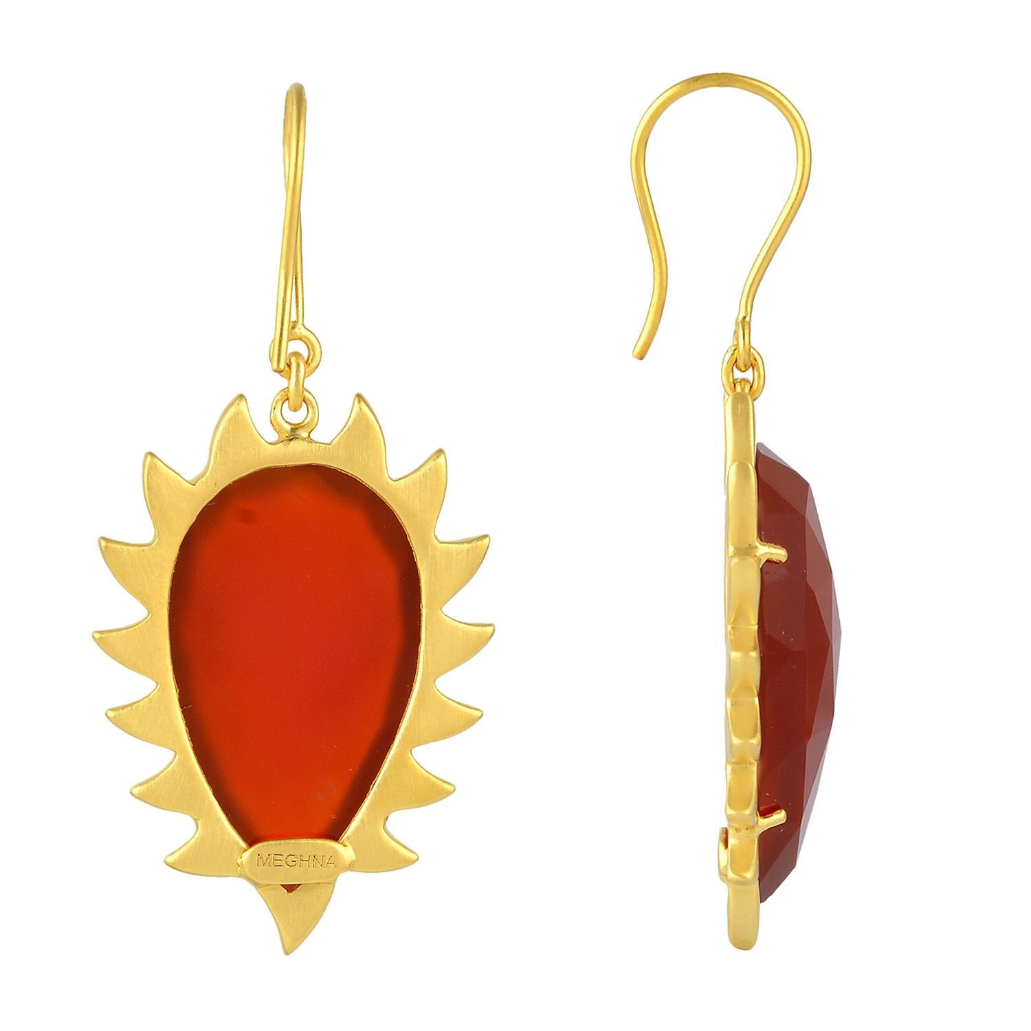 These modern and fiercely gorgeous drop earrings are handcrafted in 18K gold, sterling silver and 27.90 ct carnelian. Exquisitely framed in signature 