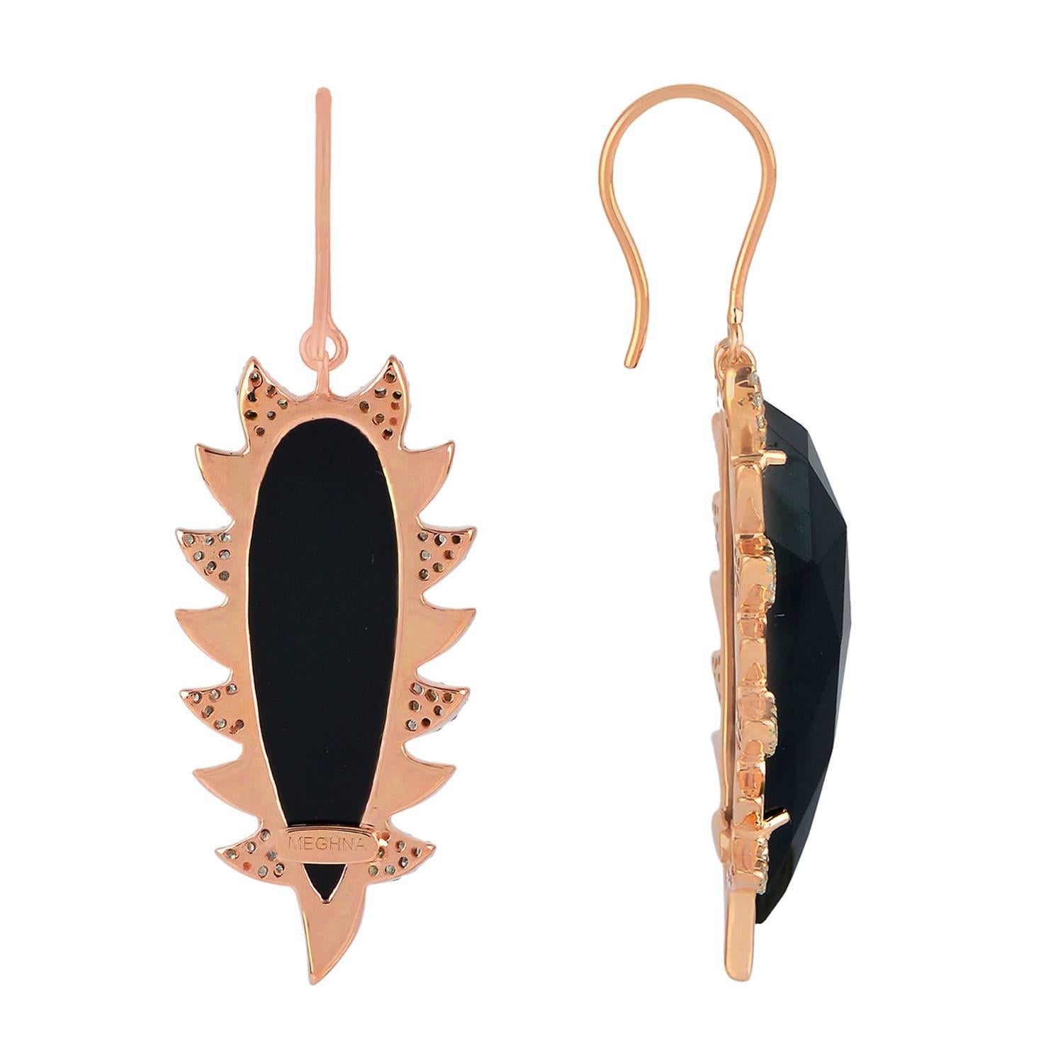 These modern, edgy and fiercely gorgeous drop earrings are handcrafted in 18K gold, sterling silver, 24.84 carat black onyx and .68 carat of sparkling diamonds. Exquisitely framed in signature 