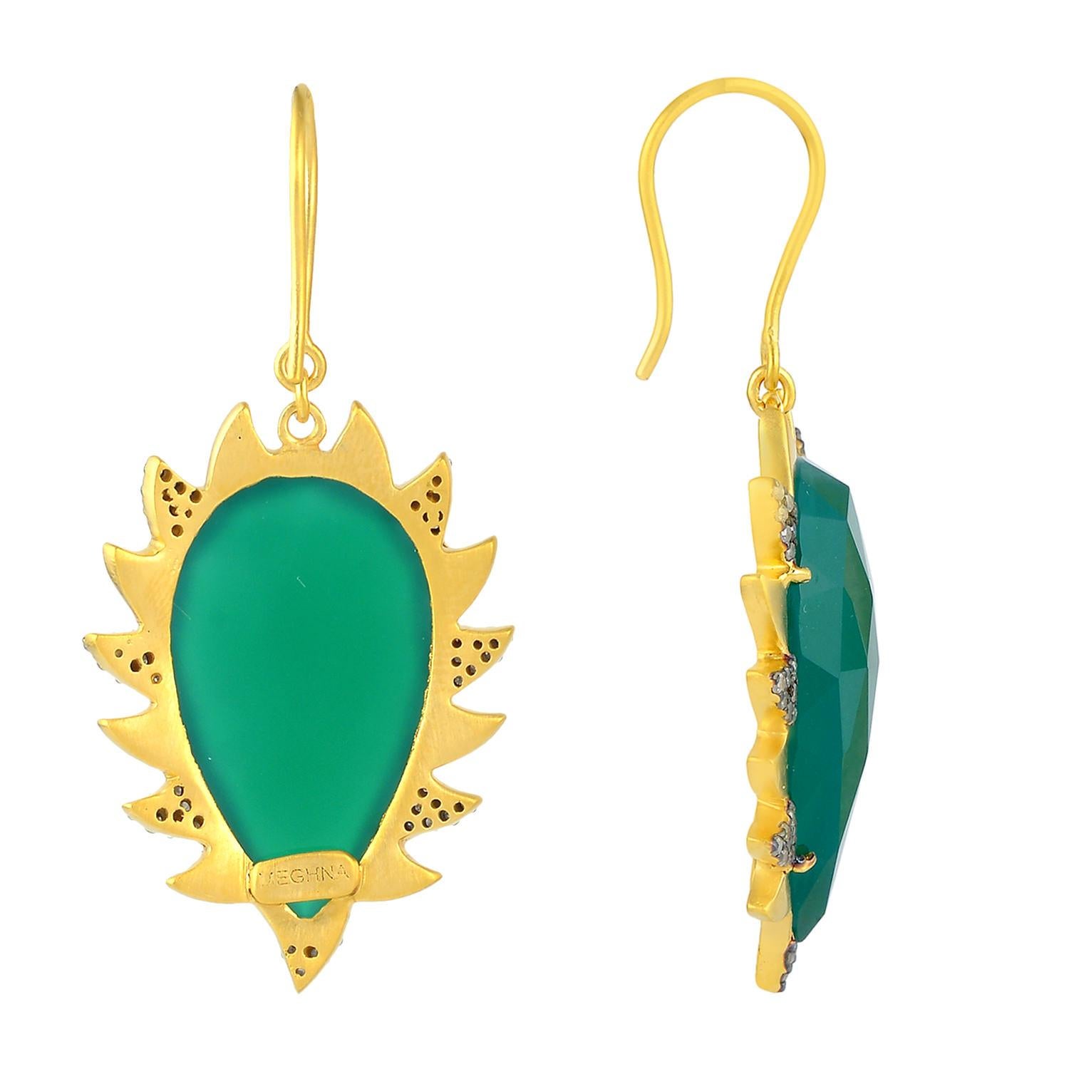  Cast in 18k gold and sterling silver. These beautiful claw earrings are handset in 27.45 carat green onyx and .50 carat of sparkling diamonds. Exquisitely framed in signature 