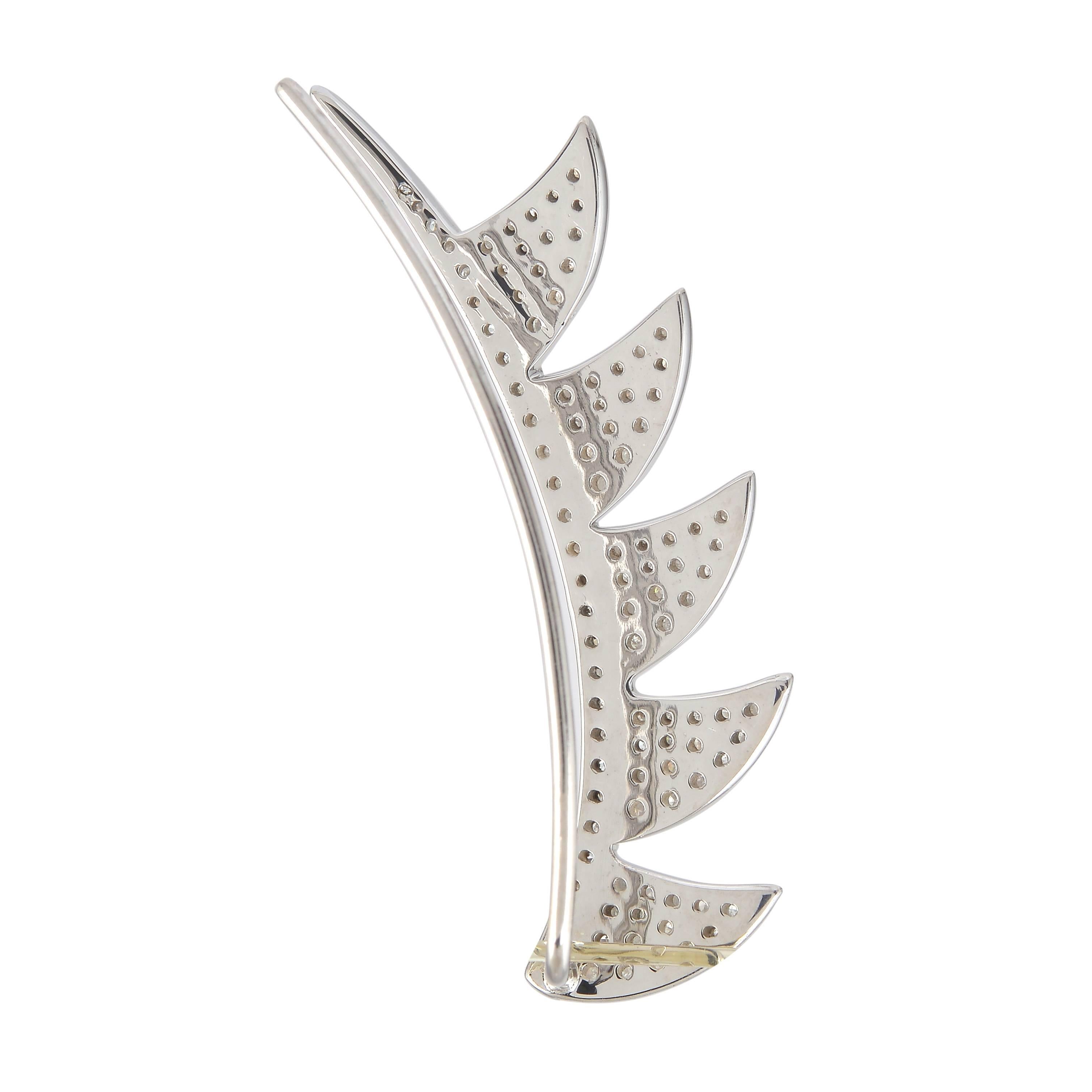 Your style is sharp, striking and ultra-modern. This single Claw ear climber falls right in line with your confident sophistication. The sterling silver pave claw arches is set with sparkling diamonds. The post connects to the bottom of the ear