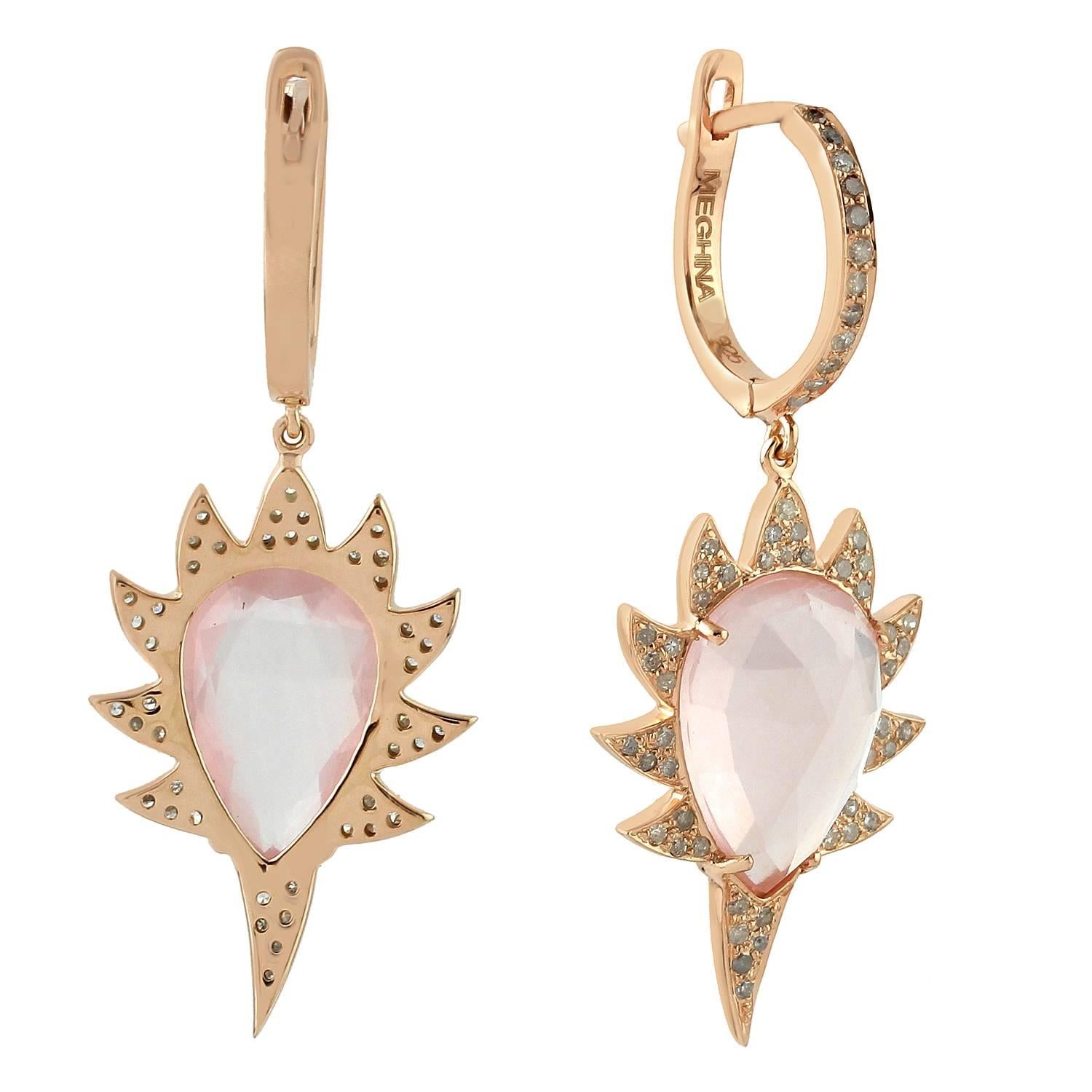 Bold and modern, these claw drop diamond earrings are cast in 14K gold & sterling silver.  It is hand set in 9.6 carat rose quartz and .66 carats of sparkling diamonds. Exquisitely framed in signature 