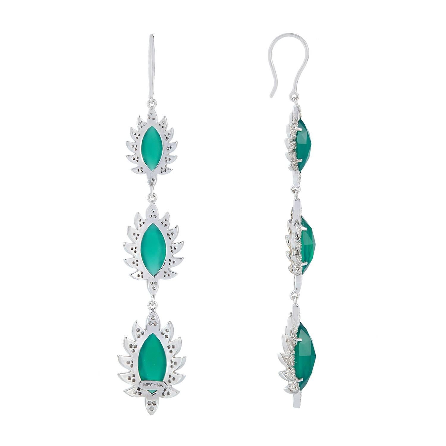 These beautiful triple drop earrings are cast in 18K gold and sterling silver. It is hand set in 11.73 carat green onyx and 1.54 carat of sparkling diamonds, french hook closures. Framed in signature 