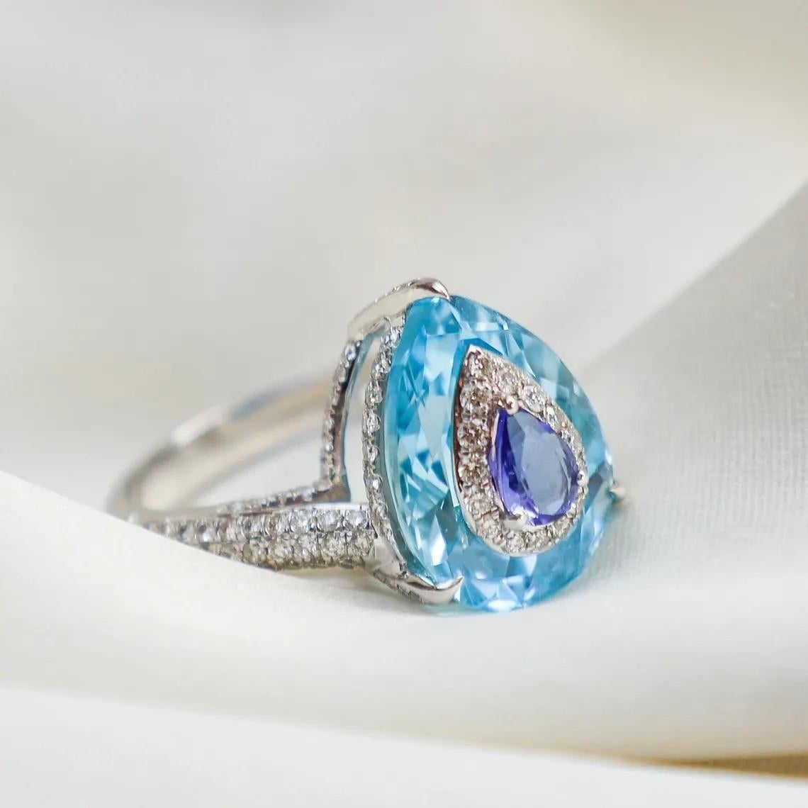 This ring has been meticulously crafted from 18-karat gold.  It is handset with 8.0 carats Blue Topaz and .93 carats sparkling diamonds. 

FOLLOW MEGHNA JEWELS storefront to view the latest collection & exclusive pieces.  Meghna Jewels is proudly
