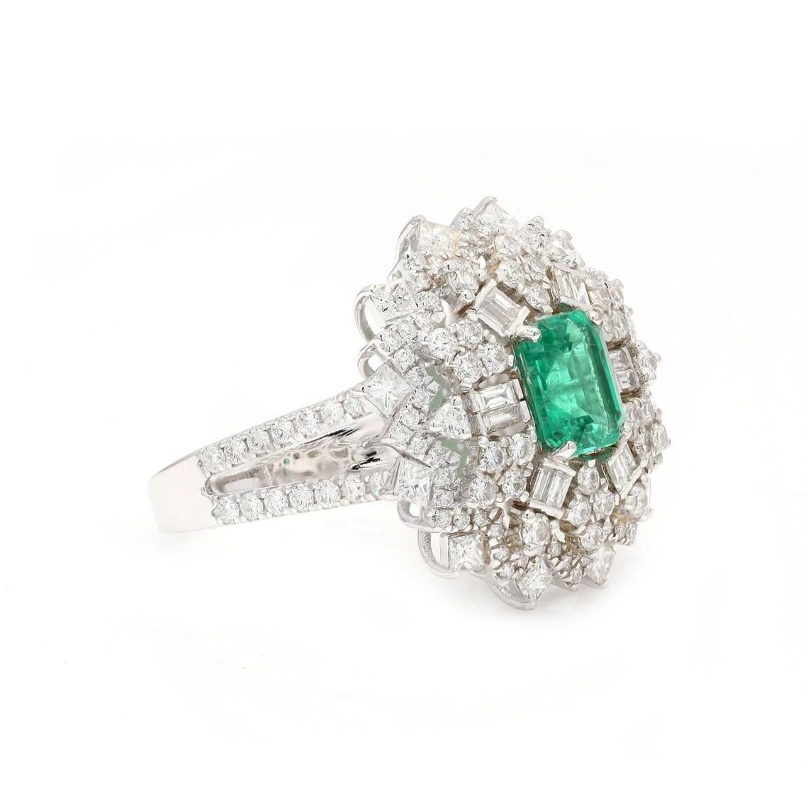 This stunning ring has been crafted from 18-karat gold. It is hand set with .88 carat emerald and 1.64 carats of sparkling diamonds. 

The ring is a size 7 and may be resized to larger or smaller upon request. FOLLOW MEGHNA JEWELS storefront to view