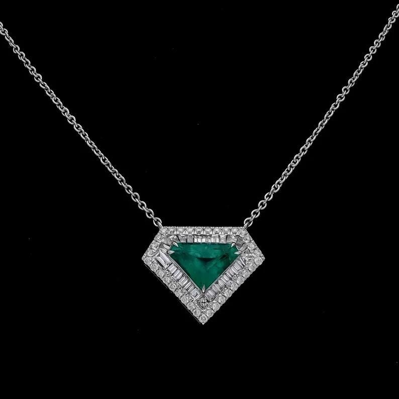 This pendant necklace has been meticulously crafted from 18-karat gold and set in 1.88 carats emerald & 1.08 carats of sparkling diamonds. 

FOLLOW MEGHNA JEWELS storefront to view the latest collection & exclusive pieces.  Meghna Jewels is proudly