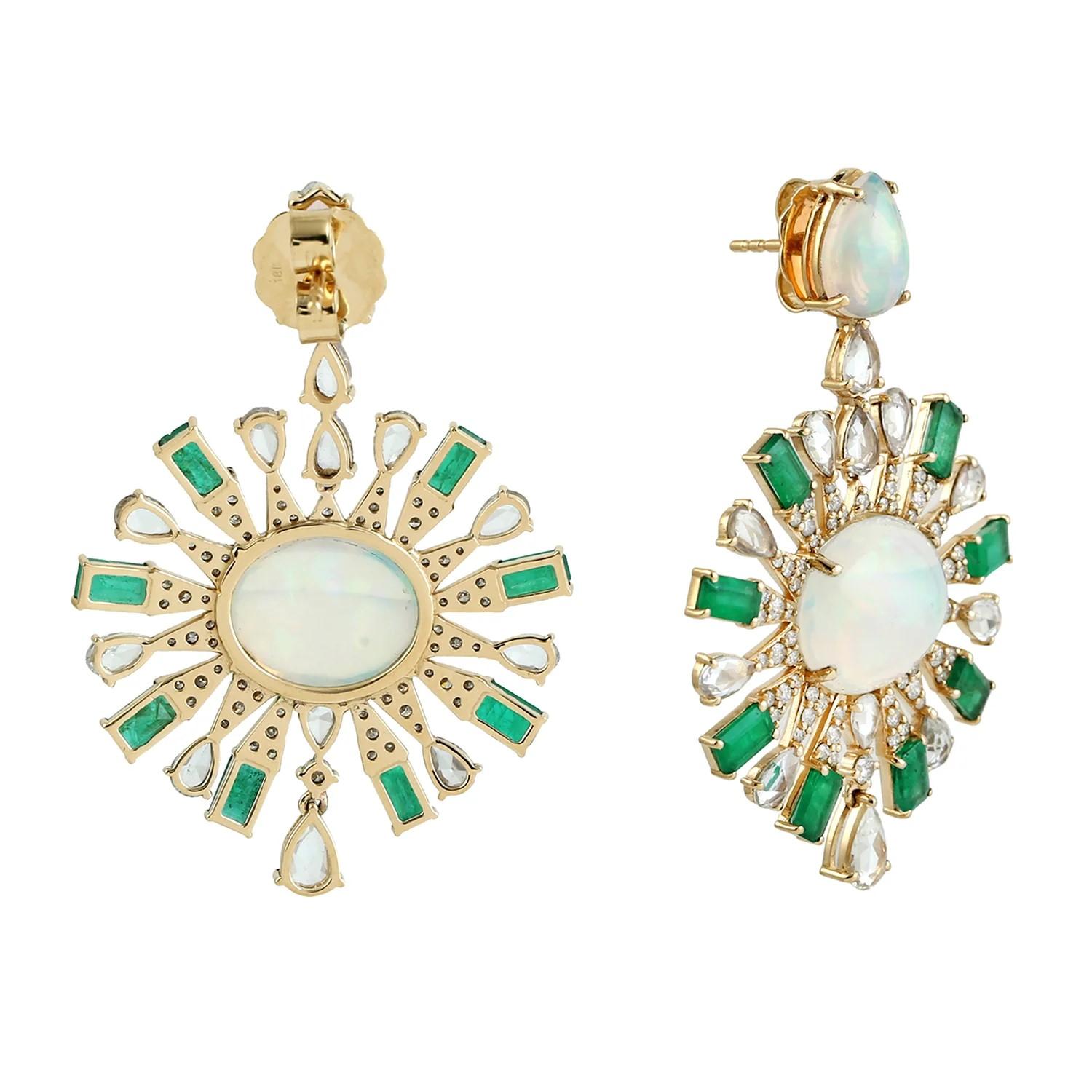 Handcrafted from 18-karat gold, these exquisite drop earrings are set with 11.61 carats Ethiopian Opal, 4.81 carats emerald and 1.17 carats of glimmering diamonds. 

FOLLOW  MEGHNA JEWELS storefront to view the latest collection & exclusive pieces. 