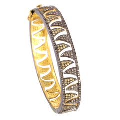 Bracelet jonc griffes imbriquées en diamants et saphirs