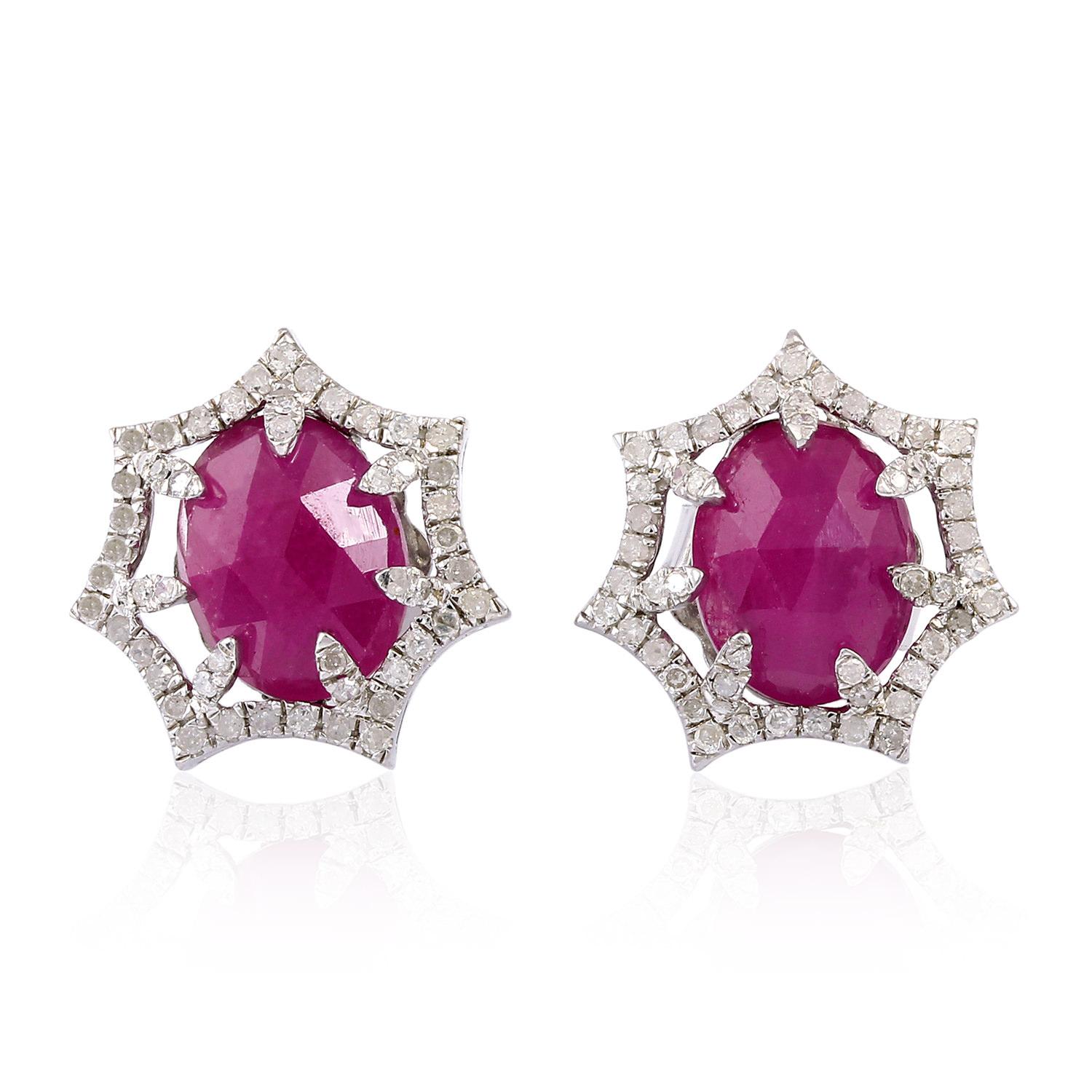 Cast from 18-karat gold and sterling silver. These beautiful stud earrings are set with 5.2 carat rubies & .57 carats of sparkling diamonds. Wear yours day or night, gently tucking hair behind your ear to keep them in focus.

FOLLOW  MEGHNA JEWELS