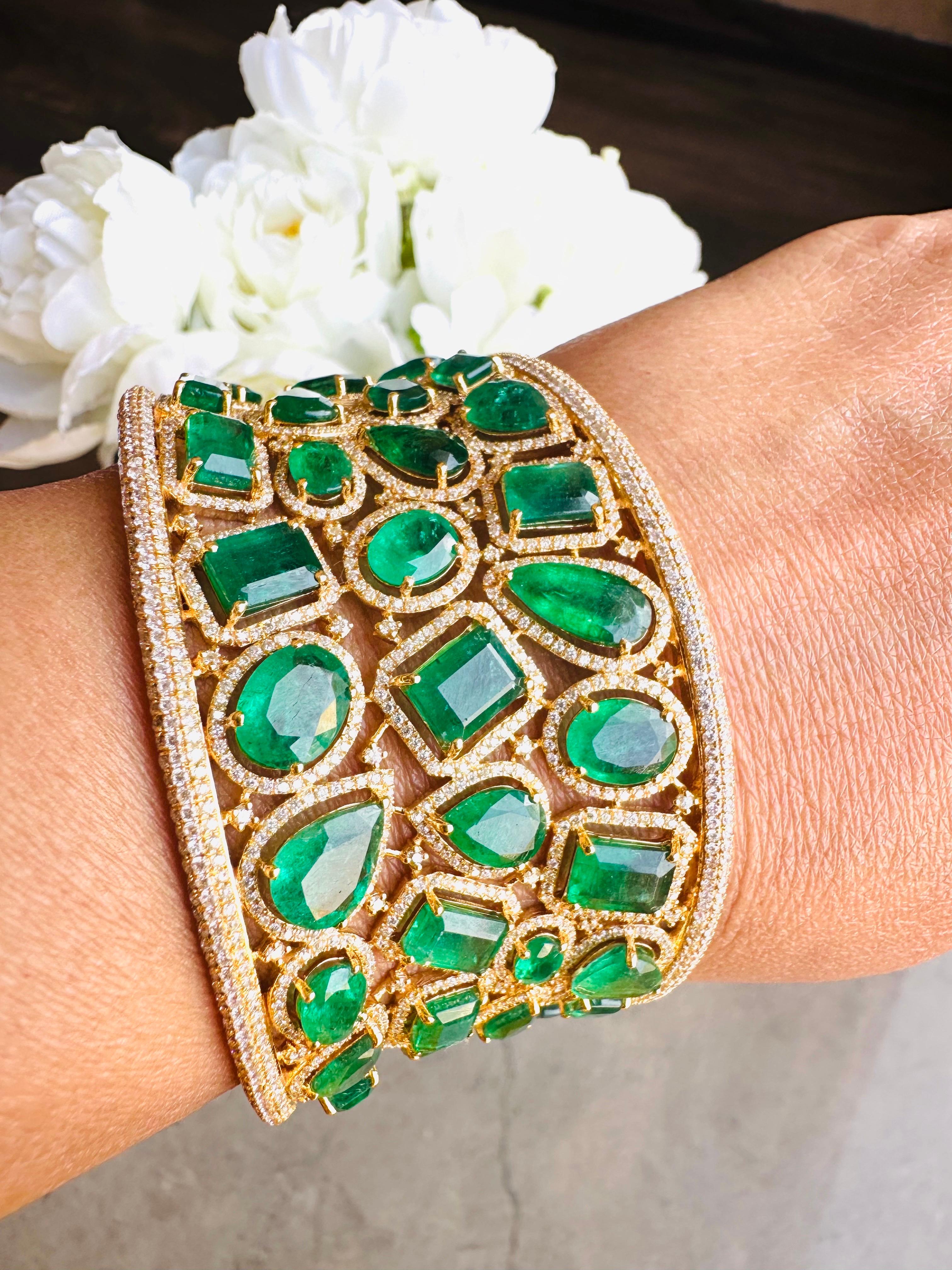 A stunning statement cuff handmade in 18K gold. It is set in 45.46 carats emerald and 10.41 carats of sparkling diamonds.

FOLLOW MEGHNA JEWELS storefront to view the latest collection & exclusive pieces.  Meghna Jewels is proudly rated as a Top