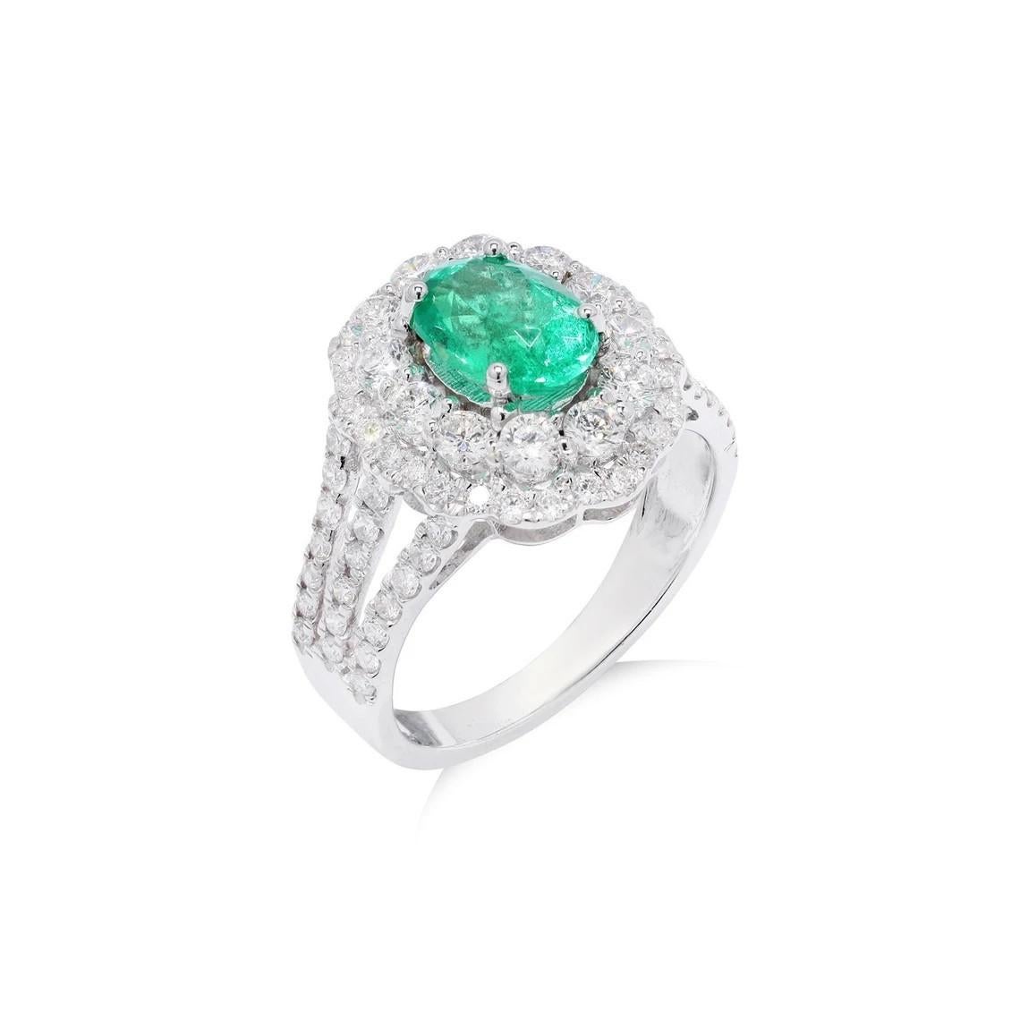 This stunning ring has been crafted from 18-karat gold. It is hand set with 1.28 carat emerald and 1.30 carats of sparkling diamonds. 

The ring is a size 7 and may be resized to larger or smaller upon request. FOLLOW  MEGHNA JEWELS storefront to