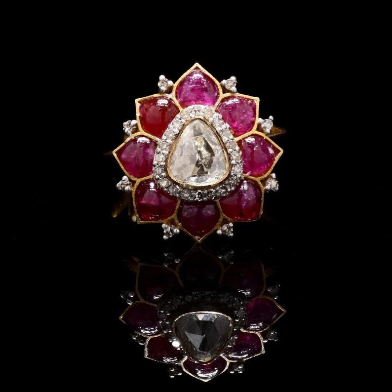 Cette bague exquise est fabriquée à la main en or 18 carats. Il est serti de rubis de 0,80 carats et de diamants étincelants de 0,52 carats.

Suivez la vitrine de MEGHNA JEWELS pour découvrir la dernière collection et les pièces exclusives. MEGHNA