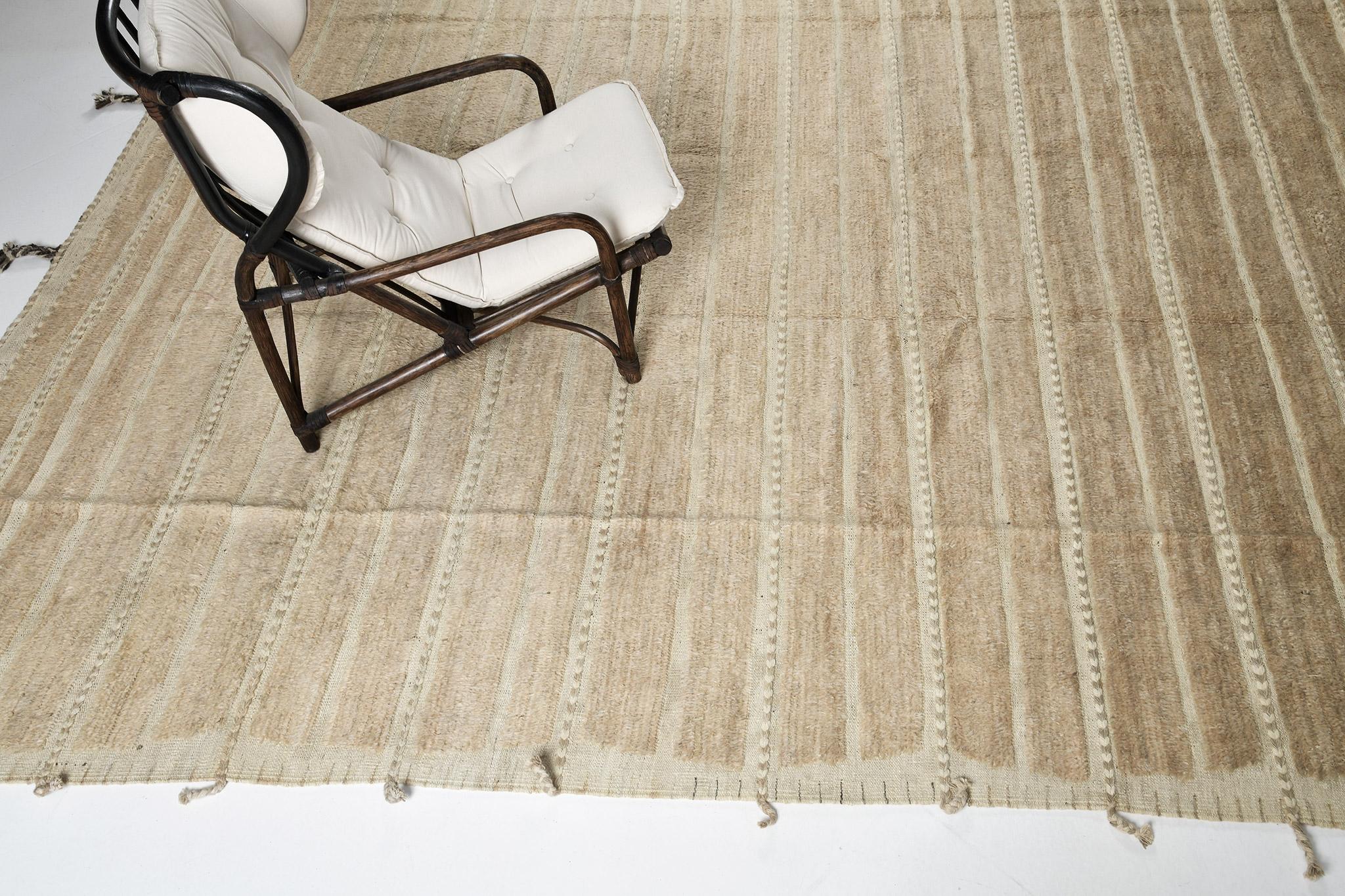 Abrolhos is a handwoven luxurious wool rug with timeless embossed detailing. In addition to its perfect khaki flatweave, Albrohos has a beautiful shag that brings a lustrous texture and contemporary feel to one's space. The Haute Bohemian collection