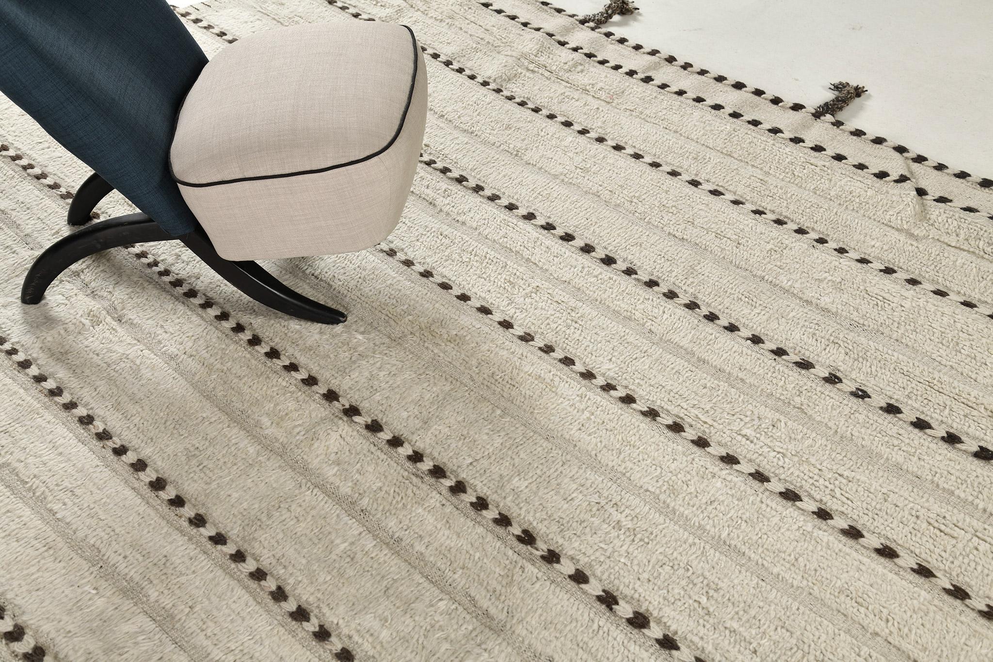 Abrolhos is a handwoven luxurious wool rug with timeless embossed detailing. In addition to its perfect ivory flatweave, Albrohos has a beautiful shag that brings a lustrous texture and contemporary feel to one's space. The Haute Bohemian collection