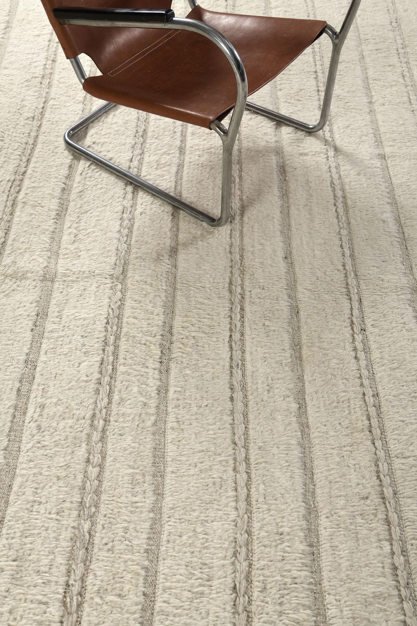 Abrolhos is a handwoven luxurious wool rug with timeless embossed detailing. In addition to its perfect brown flatweave, Albrohos has a beautiful shag that brings a lustrous texture and contemporary feel to one's space. The Haute Bohemian collection