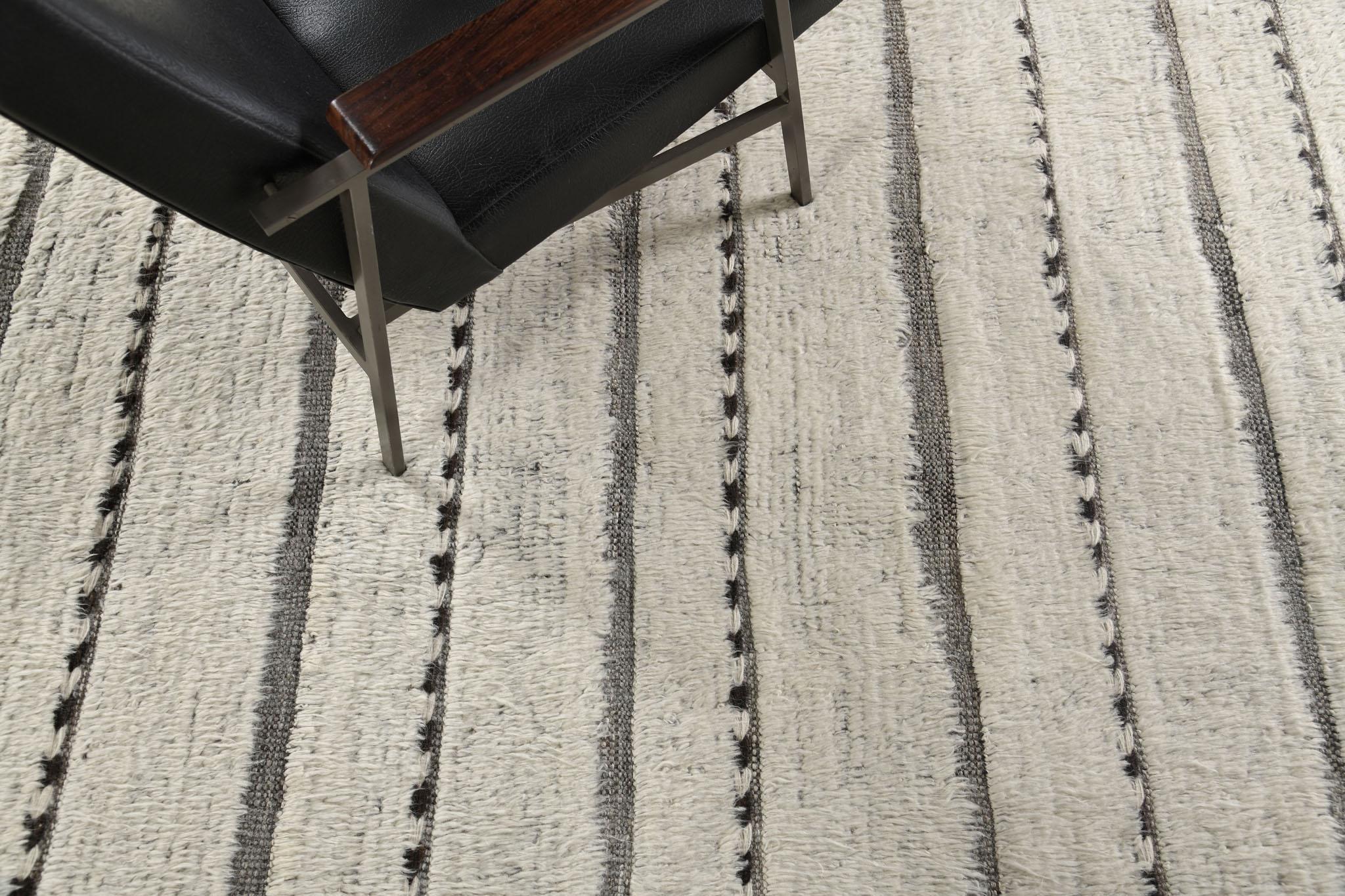 Abrolhos is a handwoven luxurious wool rug with timeless embossed detailing. In addition to its perfect brown flatweave, Albrohos has a beautiful shag that brings a lustrous texture and contemporary feel to one's space. The Haute Bohemian collection
