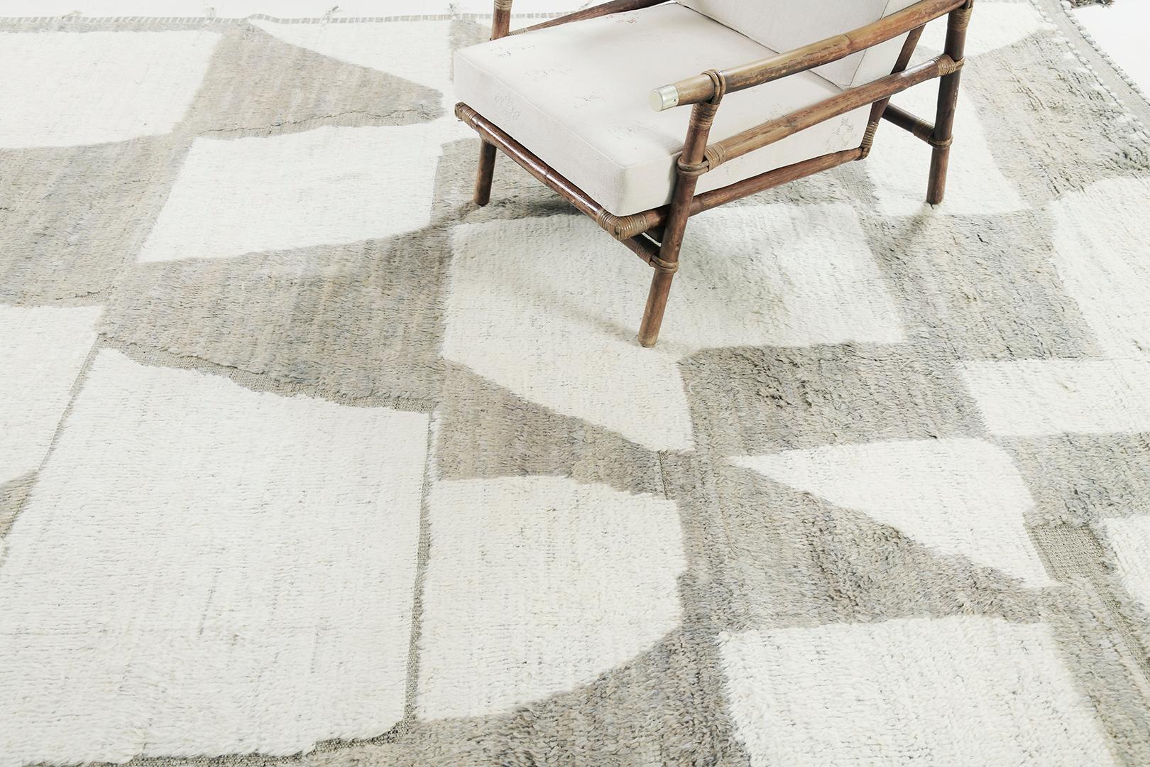 La alfombra Akal es una pieza de lana tejida a mano inspirada en elementos de diseño escandinavos para el mundo del diseño moderno. Equilibrio y armonía de la alfombra shag, tejida a mano con tonos neutros de tejido de pelo topo y marfil. Esta