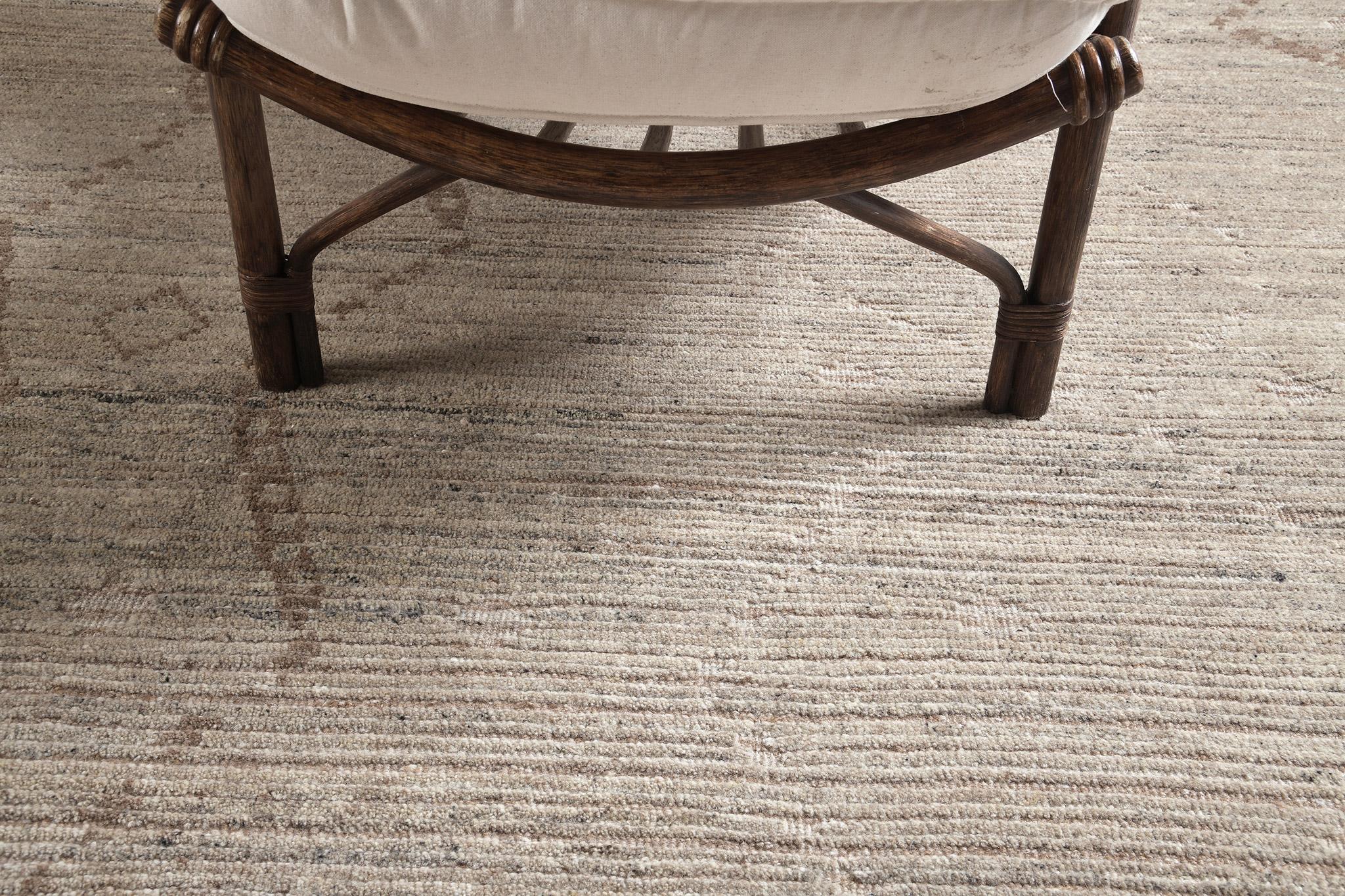 Albarino in Estancia Collection features an all over aesthetic pattern in light fawn and british tan. Lozenge patterns are featured in this mesmerizing rug representing The Eye in ancient Berber motifs that wards off the evil eye. Classy yet