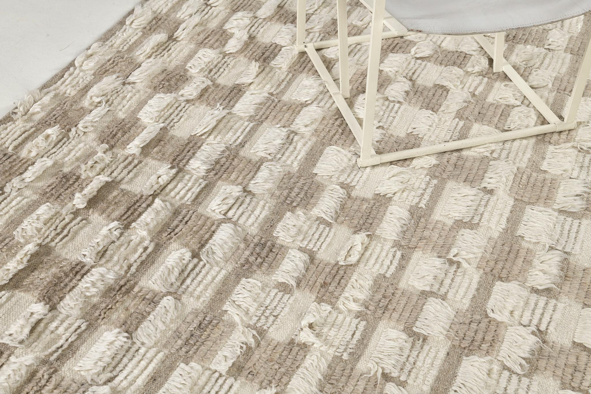 The Amia rug interlaces horizontal stripe patterns of alternating pile heights, with openings of flatweave bands. This bright neutral colorway combines ivory and natural wheat tones.

An extension of Mehraban’s popular Amihan design, the Sahara