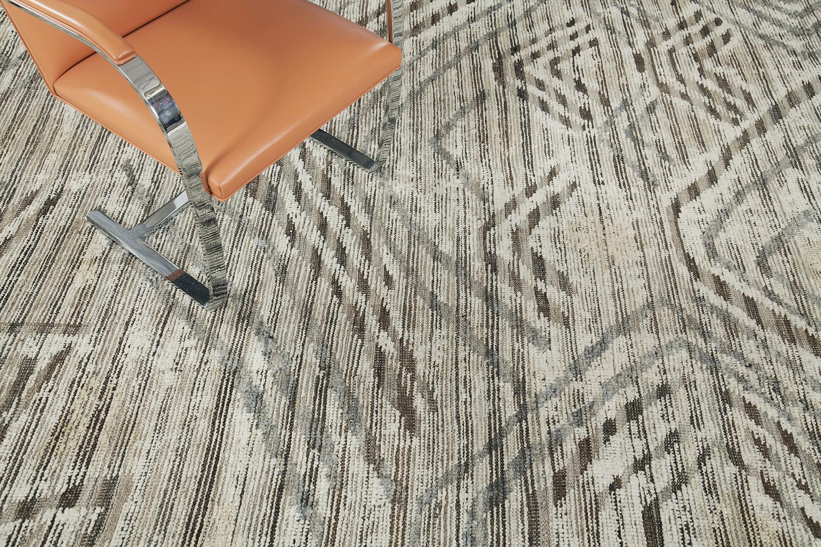 The Amsum rug is a pile woven wool piece with a stunning and stylish design. A chanterelle beige field with unique embossed detailing elements of brown, taupe, and soft gray geometrical strokes makes the rug stand out. Mehraban's Atlas collection is