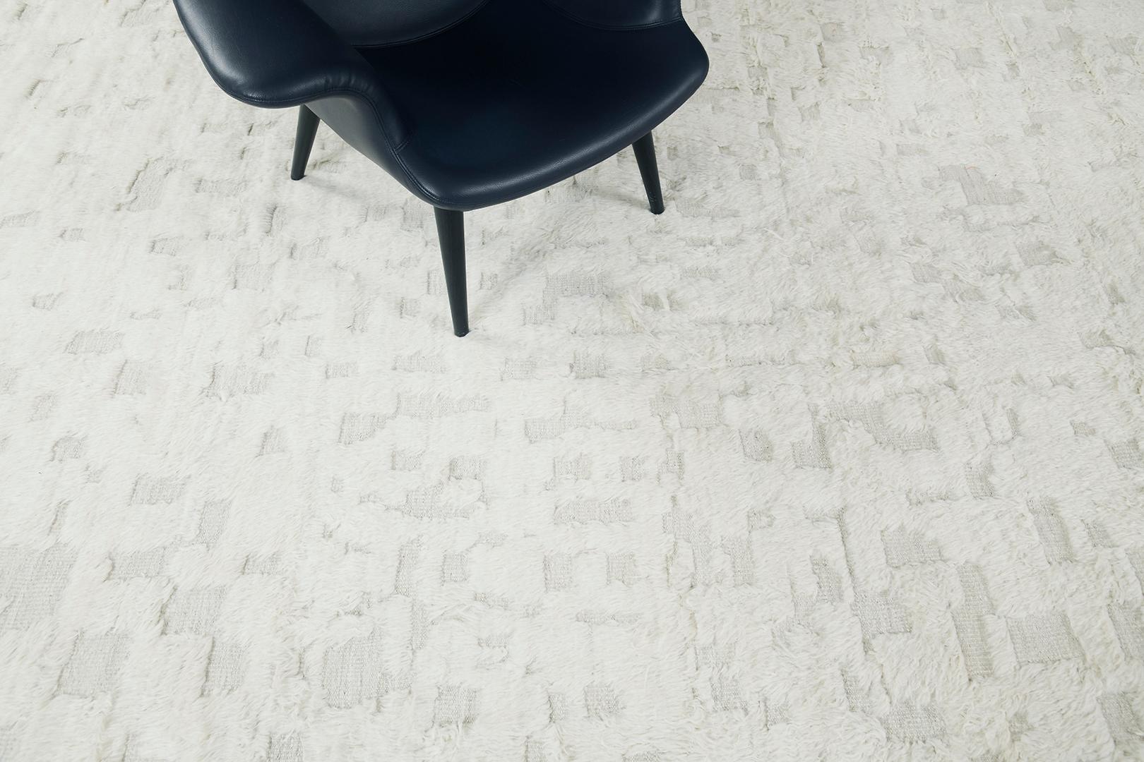 Anaruz is a pile of woven wool that features a modern-contemporary design through the shades of ivory and ecru. With its sought-after brilliant unique style, this masterpiece is everyone's dream collection. Mehraban's Atlas collection is noted for