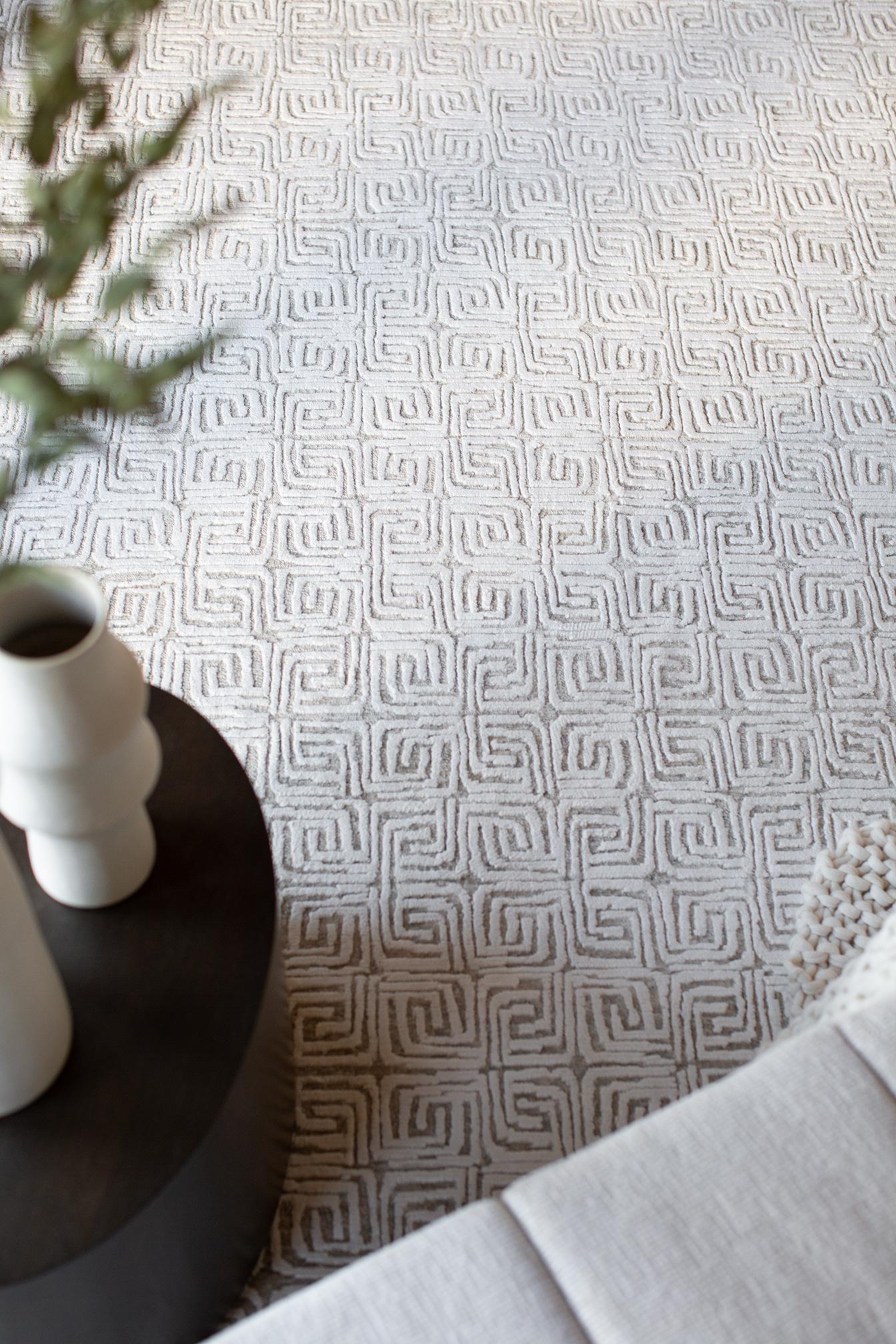 A small scale maze motif combining casual texture and trim pile.
Bright clean ivory, flecked with gray taupe tones.

Rug Number
30772
Size
8' 11