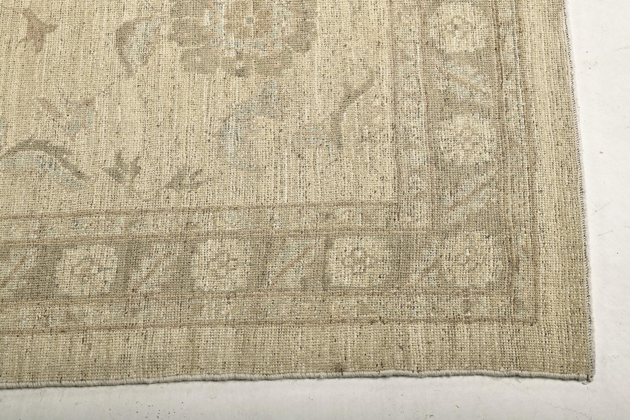 This mesmerizing Oushak design from our collection is the definition of perfection, elegance, and refinement. It features dazzling details in ivory and whites. Breath-taking leafy tendrils and scrolls, and sets of florets,  that makes the carpet