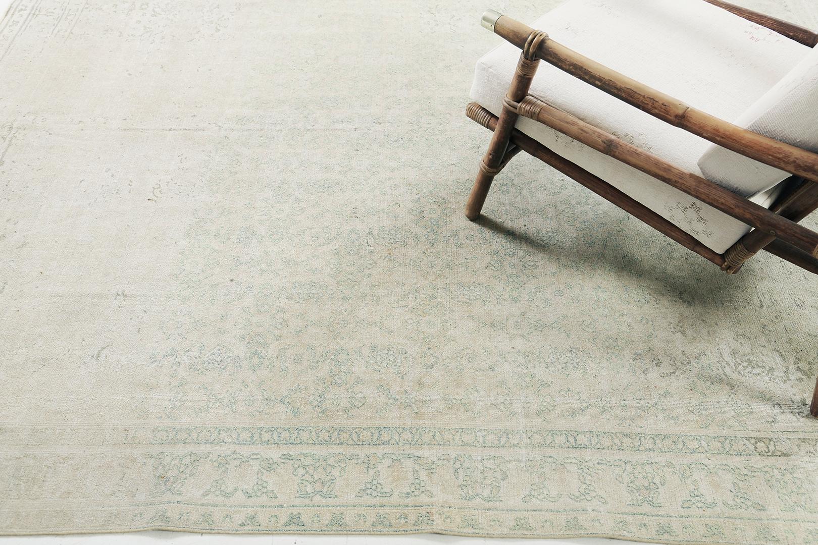 This Antique Persian Mashad rug beautifully displays timeless elegance and irresistible charm. This sophisticated piece features an all-over aesthetic floral pattern. With its compelling vibe, this Antique Persian Mashad rug perfectly embodies the