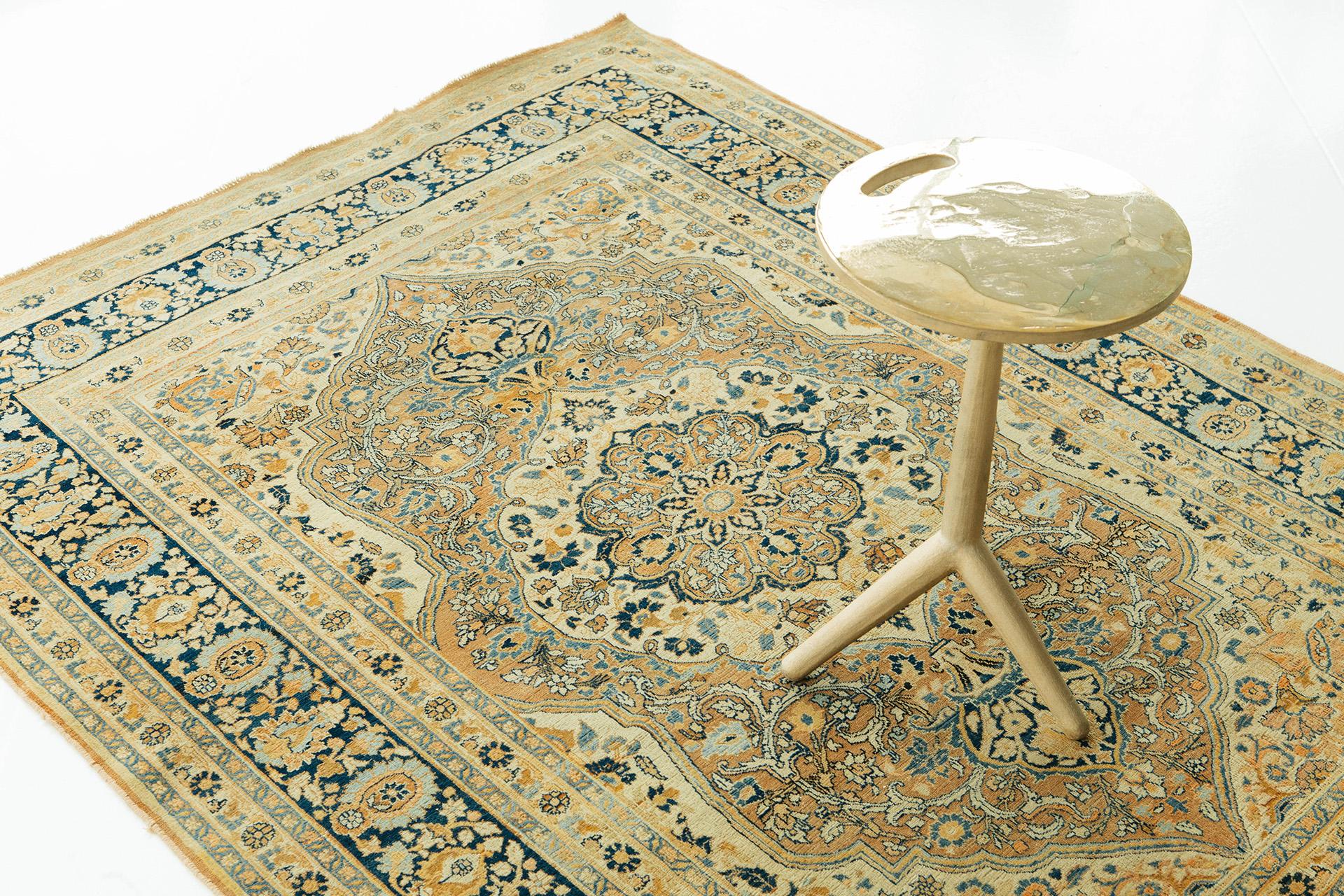 This sophisticated Persian rug from 1890 is from the region of Tabriz, a valuable city in ancient Iran. This golden masterpiece complements teal and natural hues perfectly. Adding this up to your collection will be a great fit in your guest's eyes.