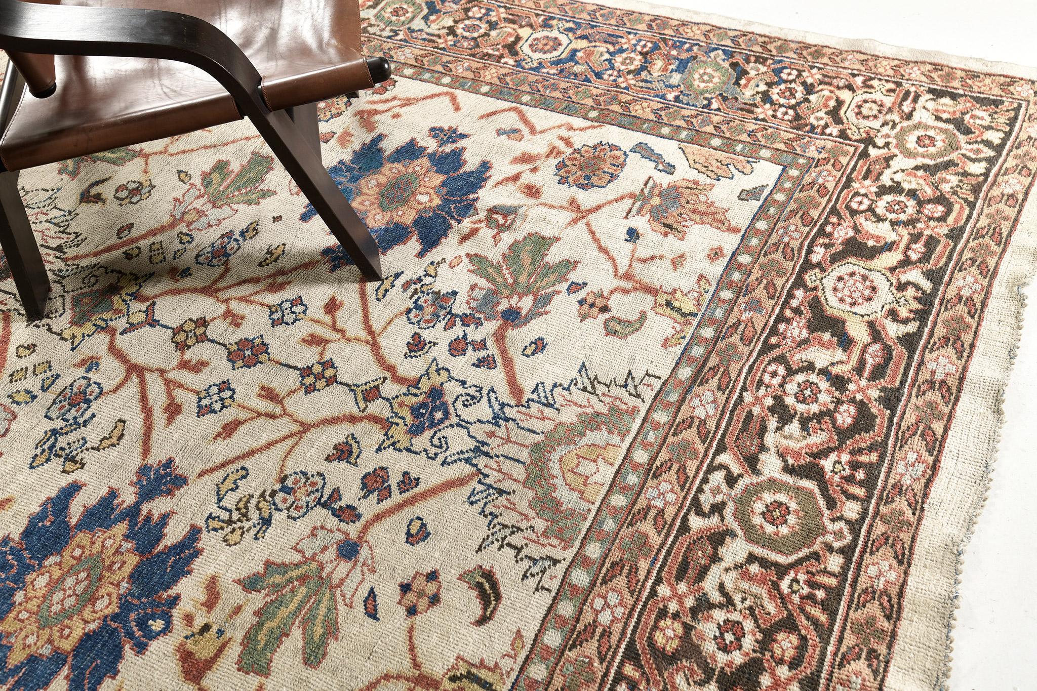 This amazing Ziegler Persian rug features a combination of earthy warm and cool-toned embellishments, a cinnamon border, and rust motifs throughout. An all-over design with an intricate floral lattice pattern and balanced density in stylized floral