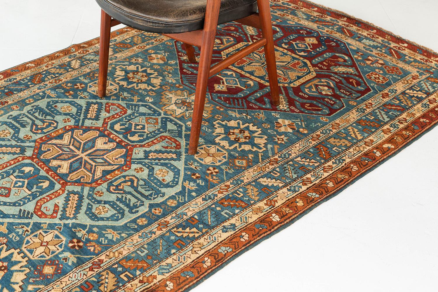 Our authentic and picturesque Persian Kube rug features multicolored weaves that will complement a whole host of designs and color patterns, making this the ultimate versatile carpet. Three expressive medallions are embellished with motifs and