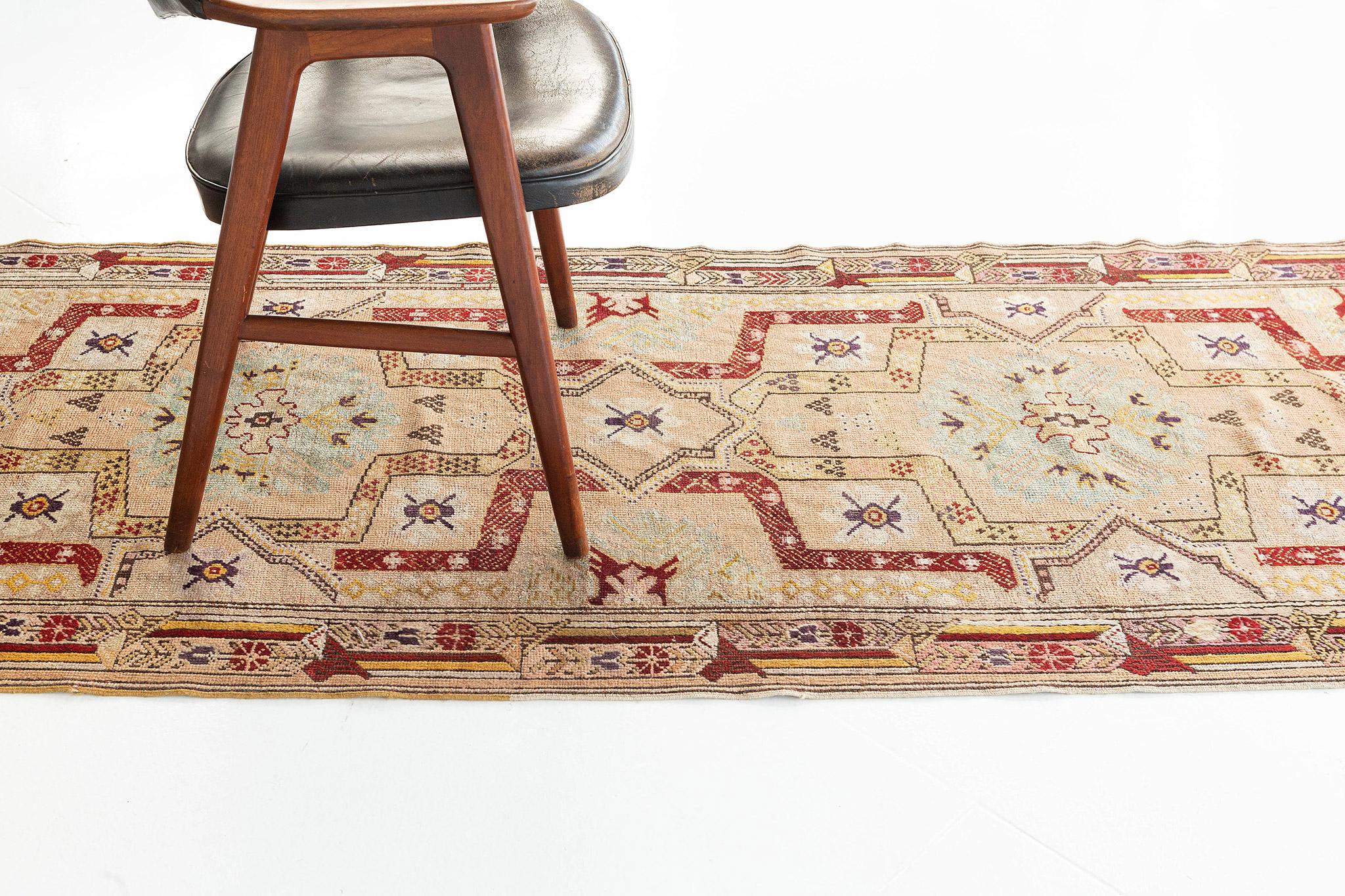 Emanating sophistication and glamour, this Vintage Turkish Anatolian runner provides an elegant and genteel design aesthetic with soft subtle hues. Four interconnected cusped medallions anchored with delicate palmette pendants floats in an abrashed