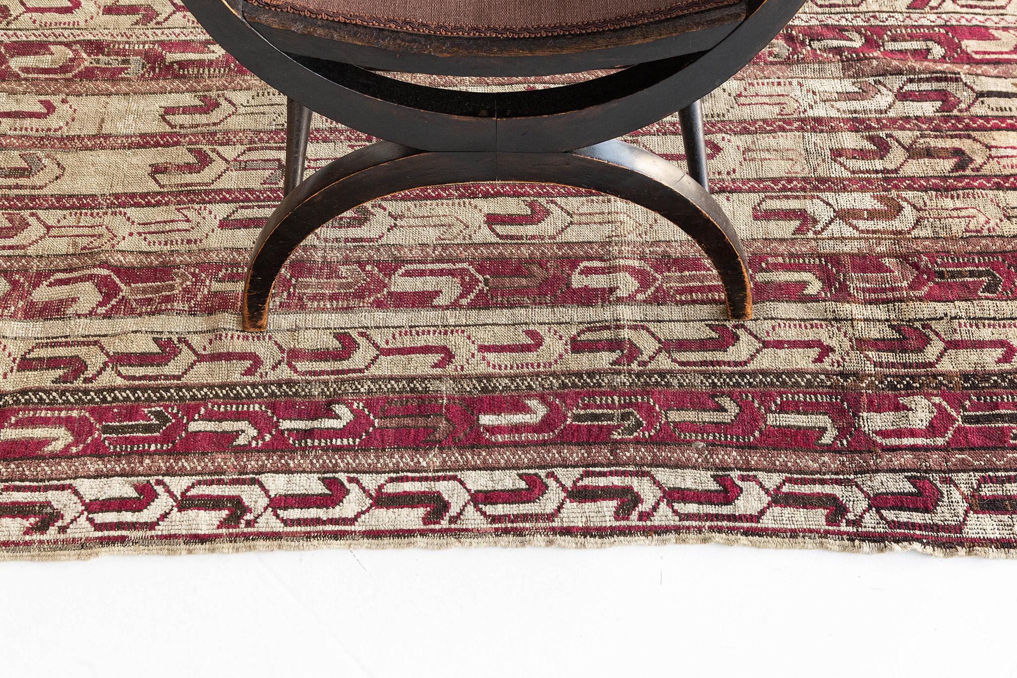 Providing elements of comfort, this Antique Turkish Anatolian rnner features an all-over ornate linear pattern accentuated with ambiguous compositions. Exuding its hygge vibes, displays the all-over vibrant toned repetitive symetrical shapes forming