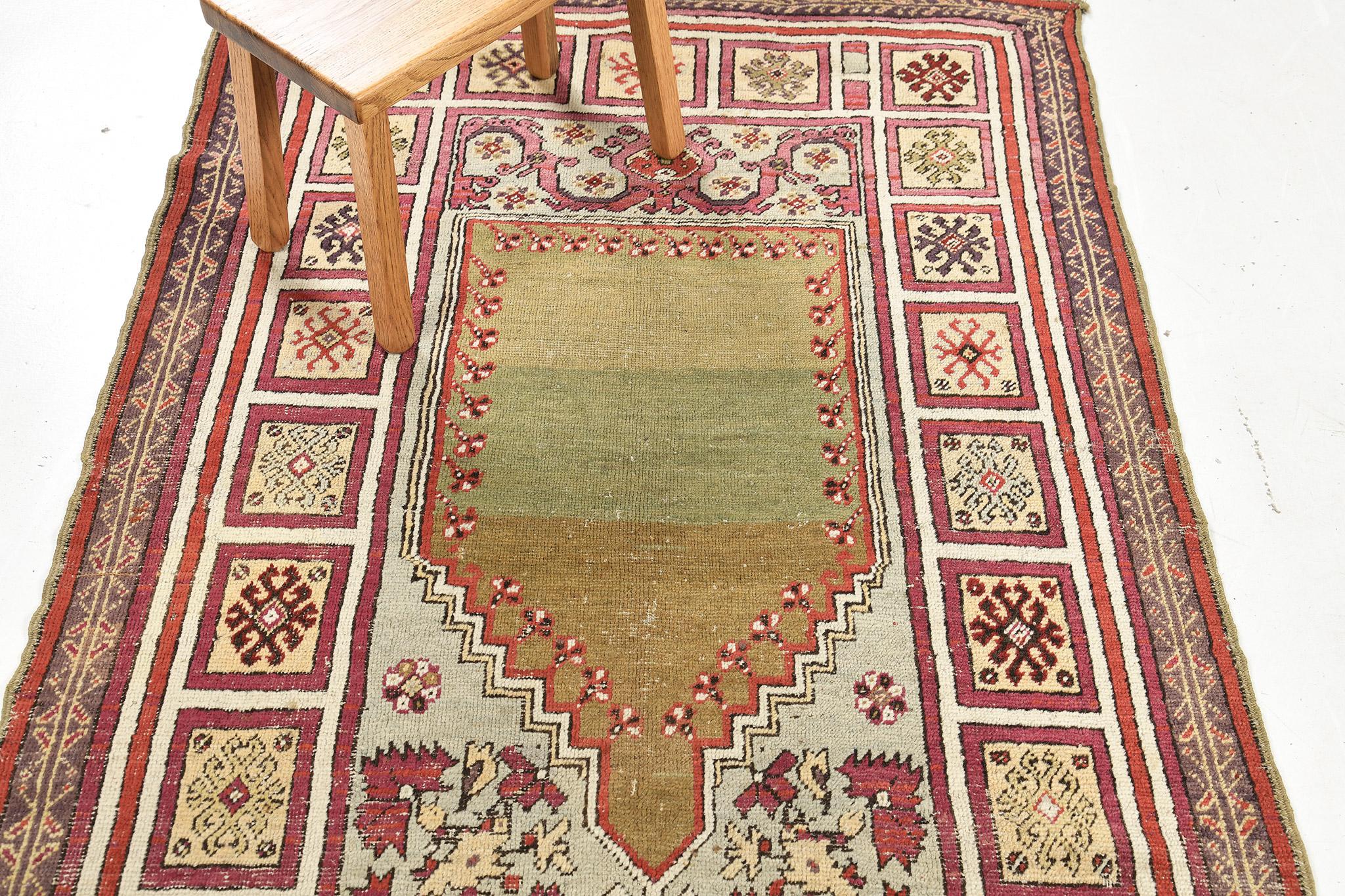 This remarkable Turkish Kirshir rug has its feature of multi-colored beautiful imagery. Compose of an arch-shaped design and surrounded by multiple motifs that make it's own and unique. A collector's item that ideal for wall decor and