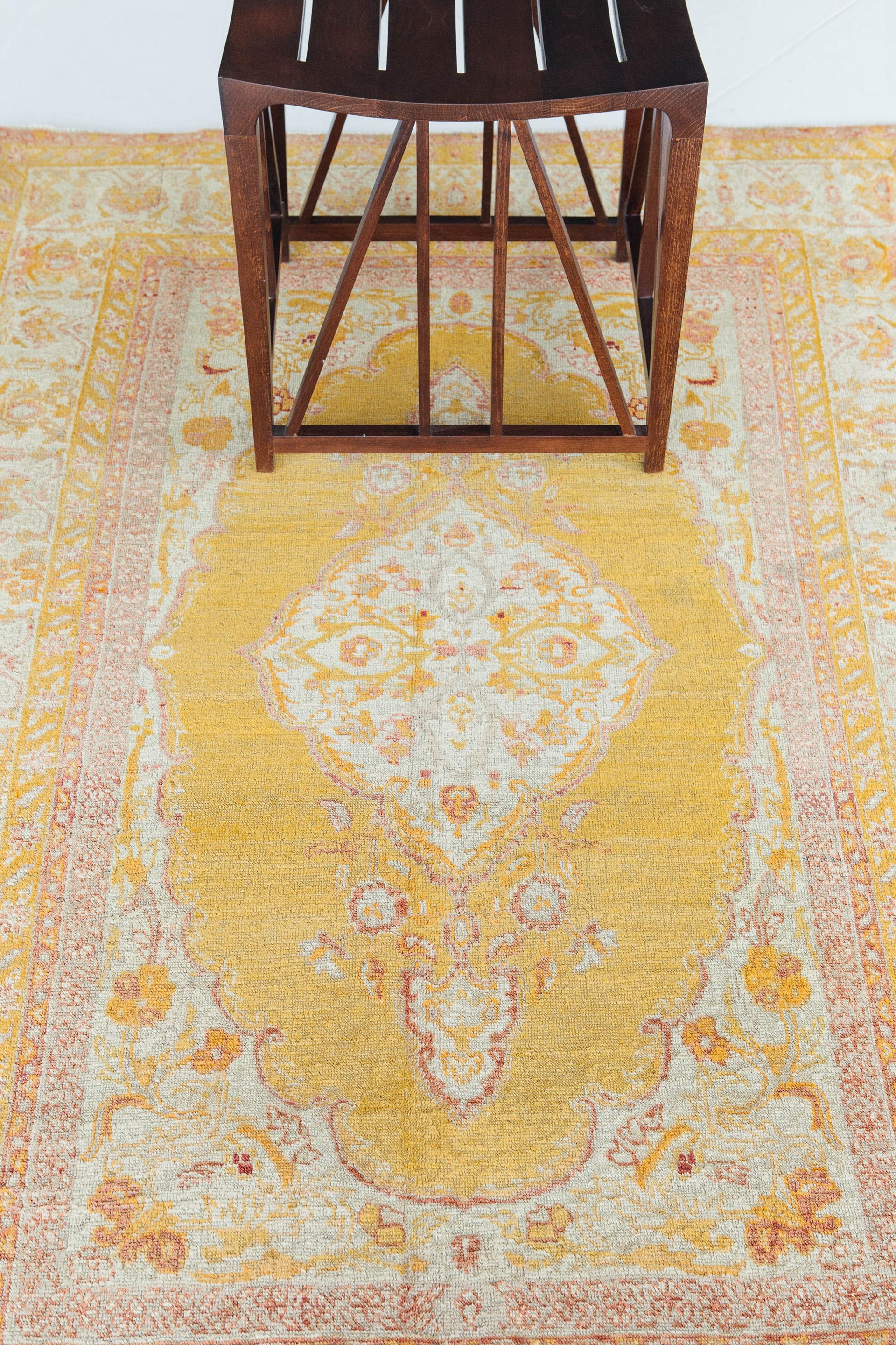 An impressive centerpiece for any room that captivates you in brilliant yellow and red hues. With its grandiose motifs at the core and surrounded by motifs, it brings your whole vision of light and peace. Having this one-of-a-kind Turkish rug will