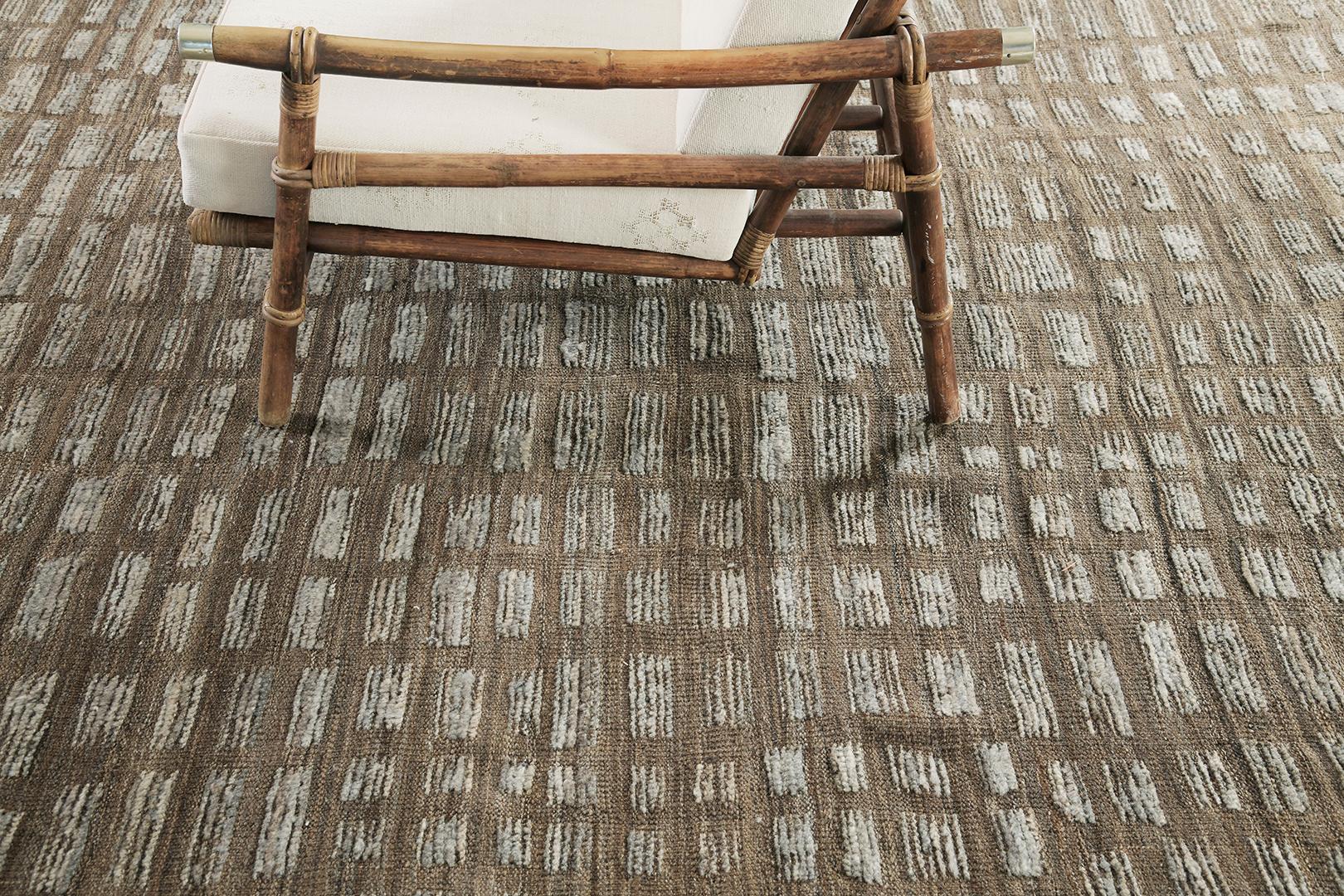 Byzacena features a series of symbolic motifs that complement the entirety of this breathtaking rug. Lozenges and X motifs in the brilliant shades of charcoal, gray and flaxen bring sophistication to this elegant rug. Mehraban's Atlas collection is