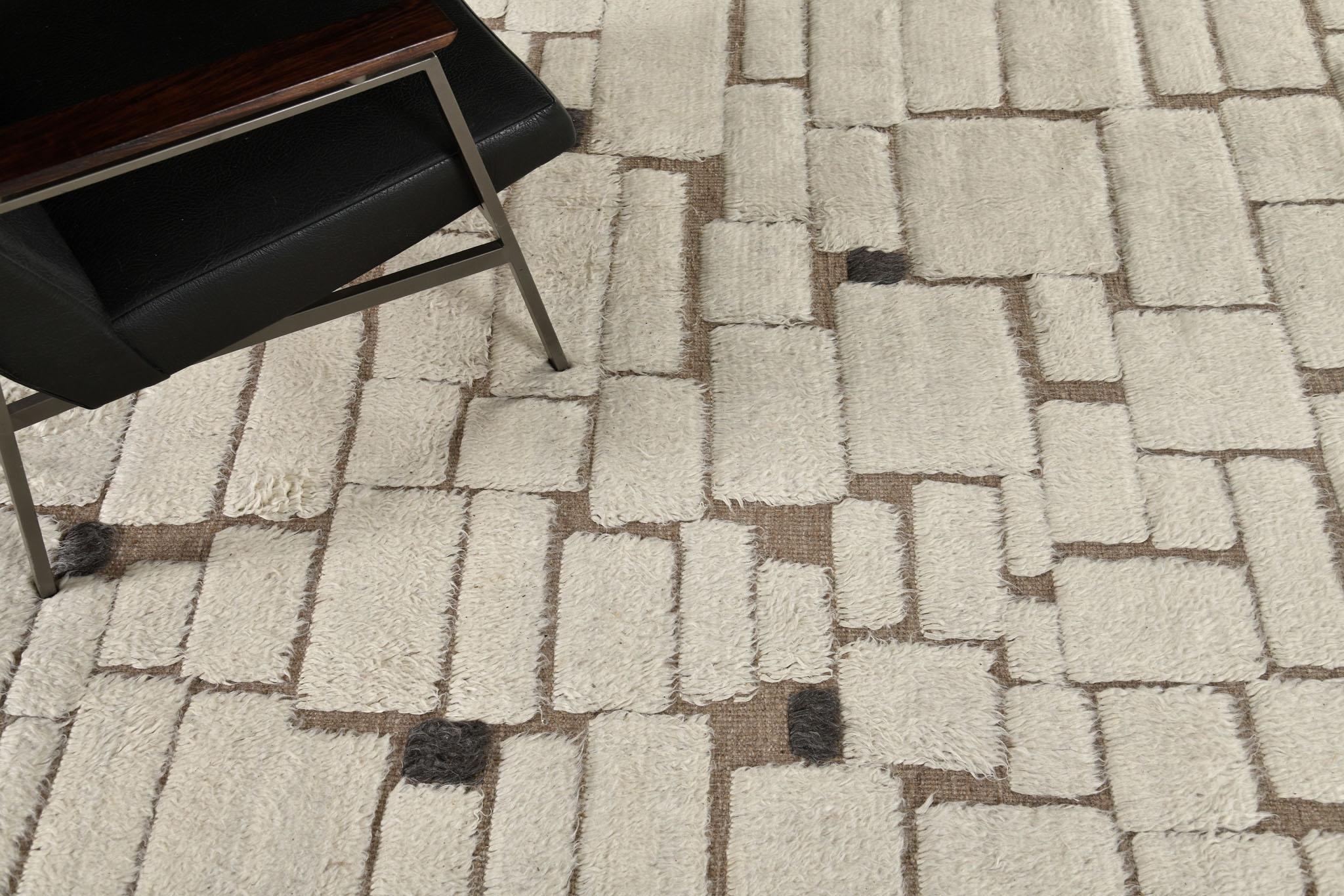 Avocet has gorgeous wool that features an ivory, mocha and gray embossed rectangular that gives your home a stylish charm. The playfulness of this masterpiece makes you feel creative in every color scheme. Sandpiper collection designed in Los