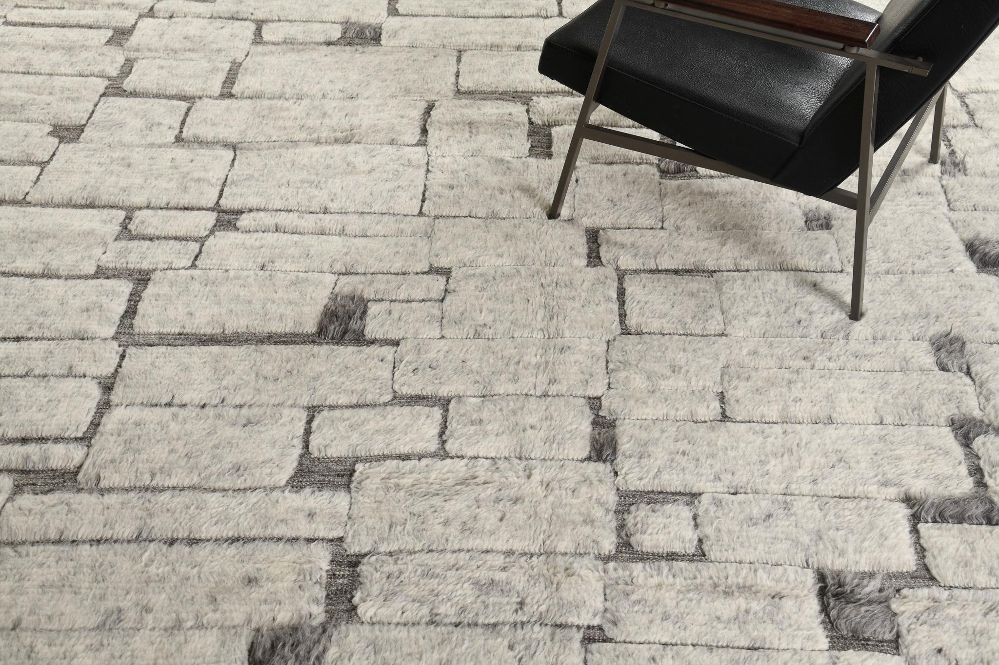 Avocet has gorgeous wool that features a gray and beige embossed rectangular design that gives your home a stylish charm. The playfulness of this masterpiece makes you feel creative in every color scheme. Sandpiper collection designed in Los Angeles