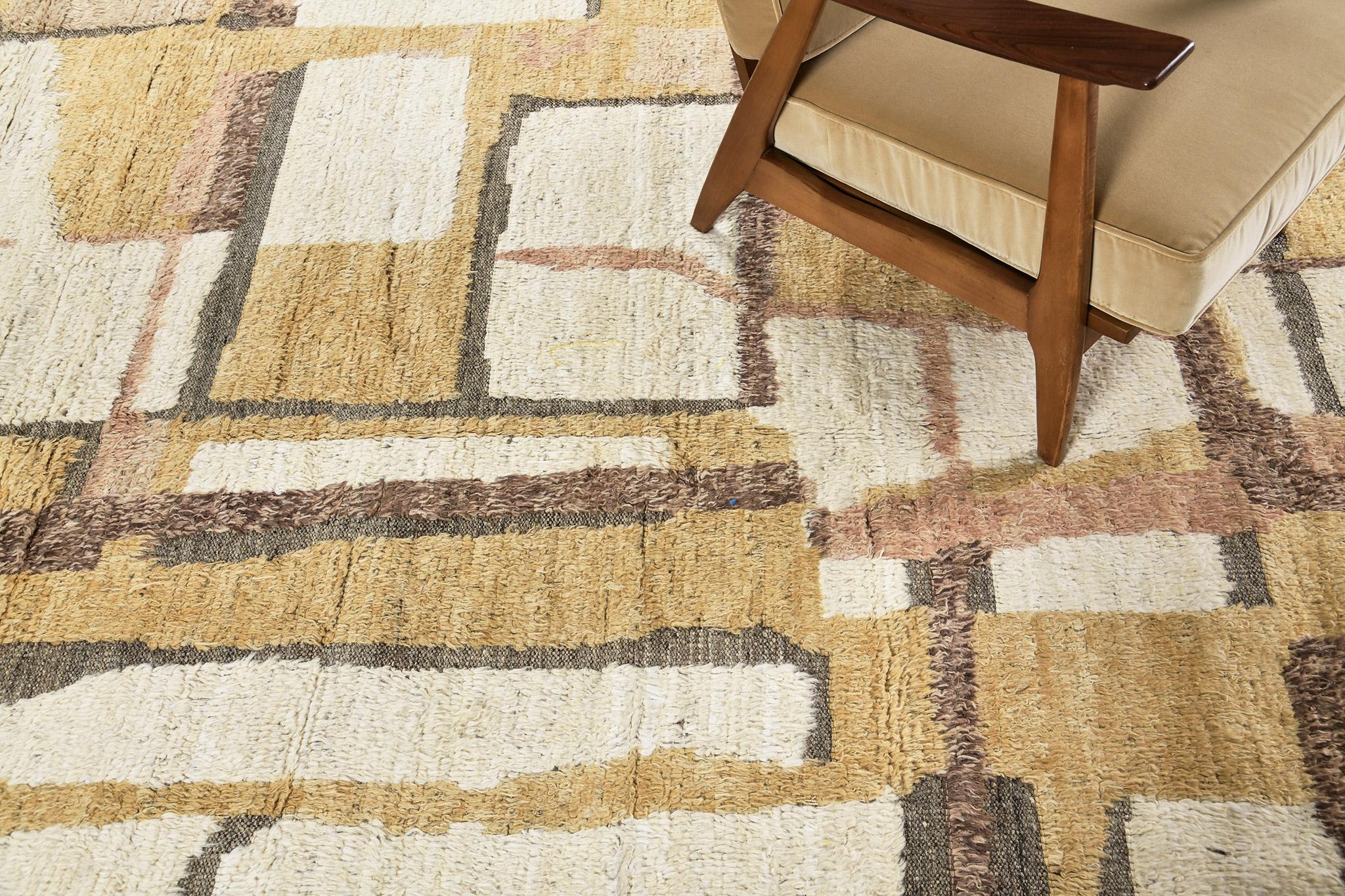 Aziza' is a warm and lustrous wool rug with a unique play of colours and irregular shapes. This pile weave has embossed textures and unique tassel detailing which makes this piece highly sought after. Mehraban's Atlas collection is noted for their