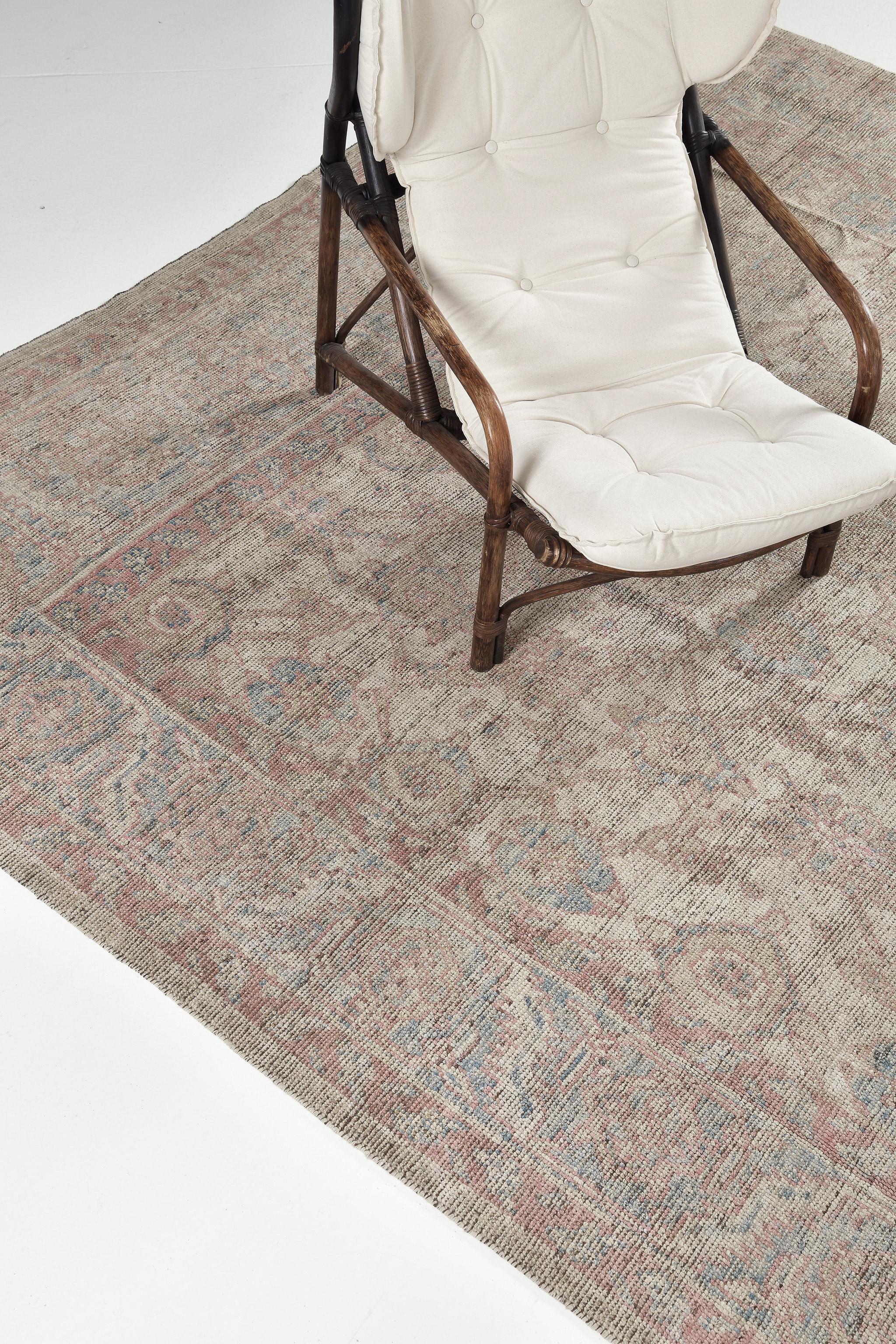A breathtaking muted revival of Bakhshaish design rug that combines the stunning palmettes and statement vines connected by the leafy tendrils in the shades of coral, dusty blue and beige. This breathtaking rug has a magical presence provided by the