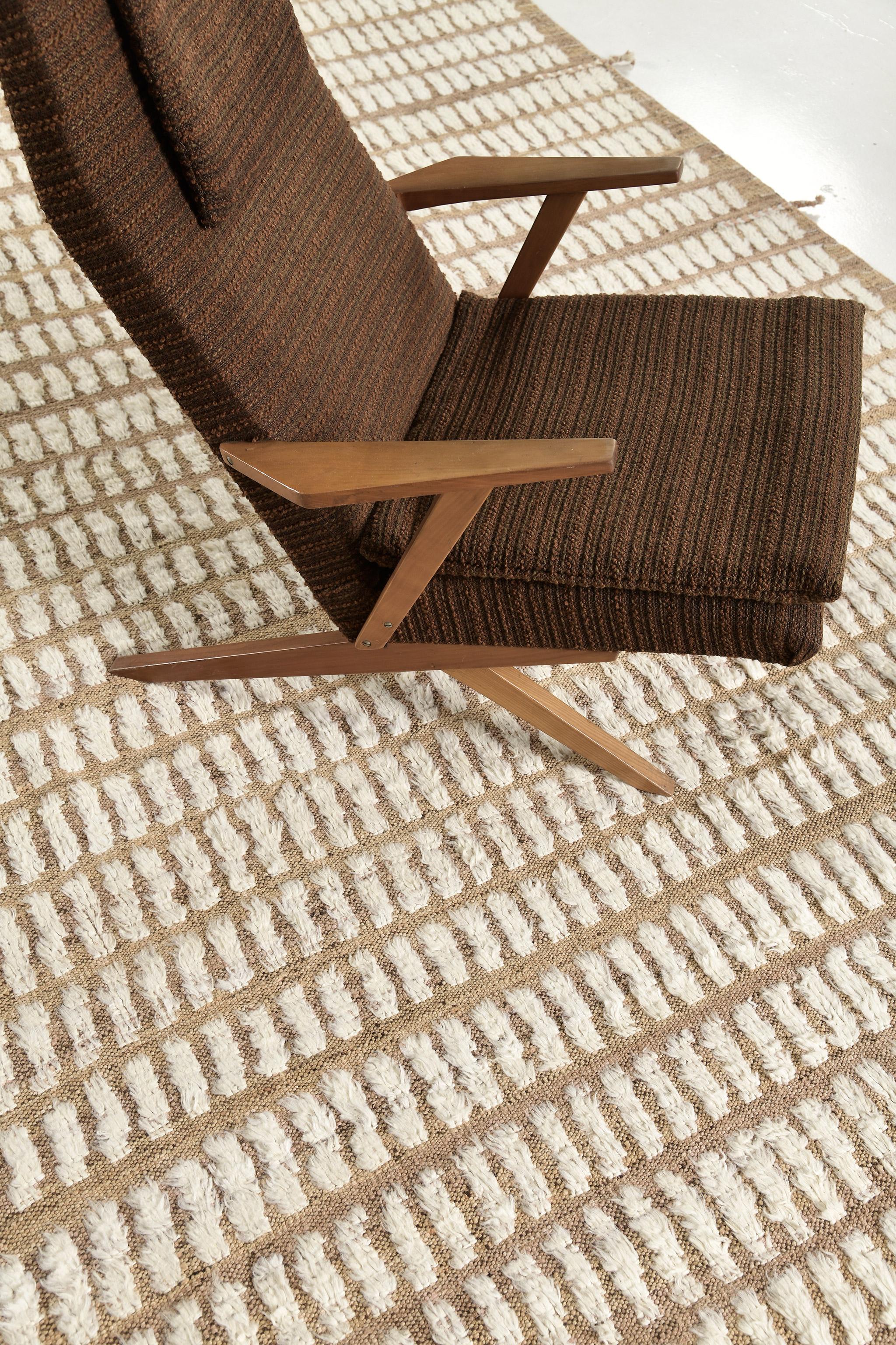 Barguzin is a handwoven impressive wool rug with timeless embossed patch detailing. In addition to its perfect neutral-toned pile weave, Barguzin has an elegant shag that nourishes a lustrous texture and contemporary feel to one's space. The Haute