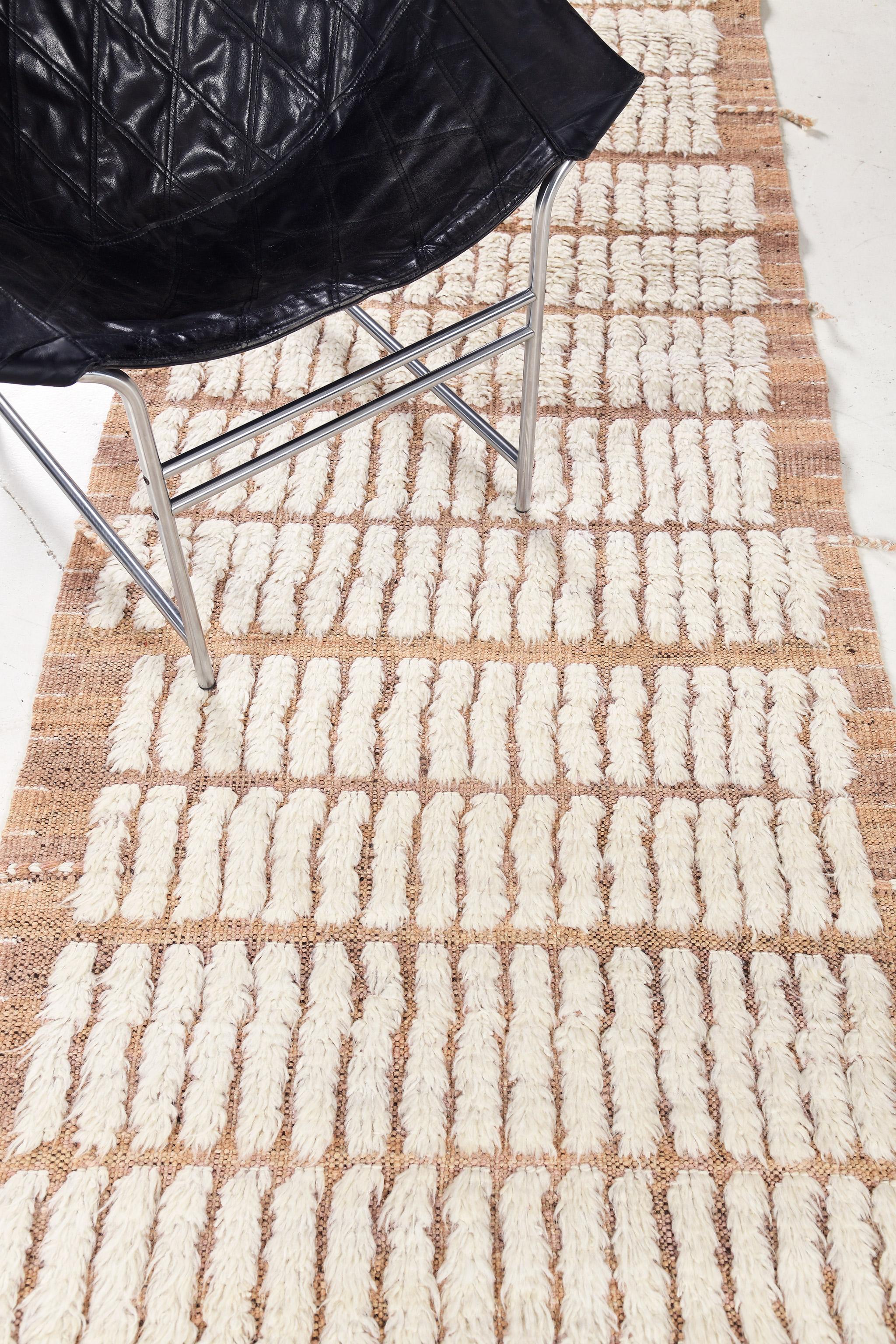 The signature Collection of California. Handwoven luxurious wool rug, made of timeless design elements and neutral earth tones with the perfect shade of white shag. Haute Bohemian collection: designed in Los Angeles named for the winds knitting