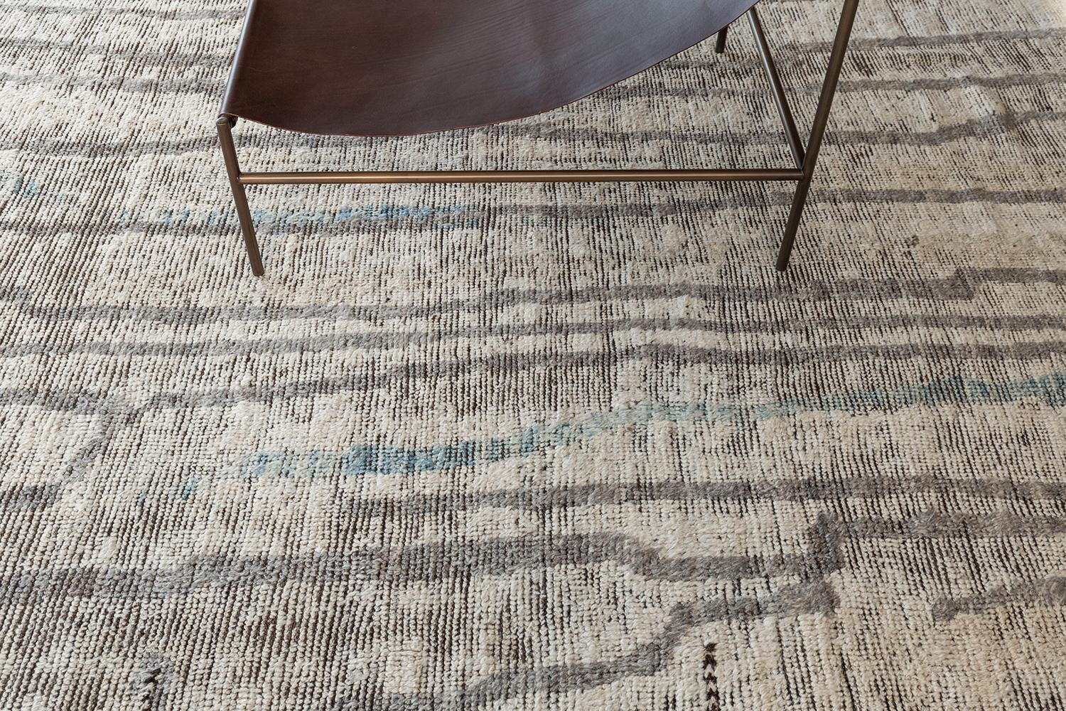 Berberis' is an interplay between natural earth tones and soothing muted colours into a modern day interpretation of the Moroccan world. This rug's play of textures, linework, and unique shapes is what makes the Atlas Collection so unique and sought